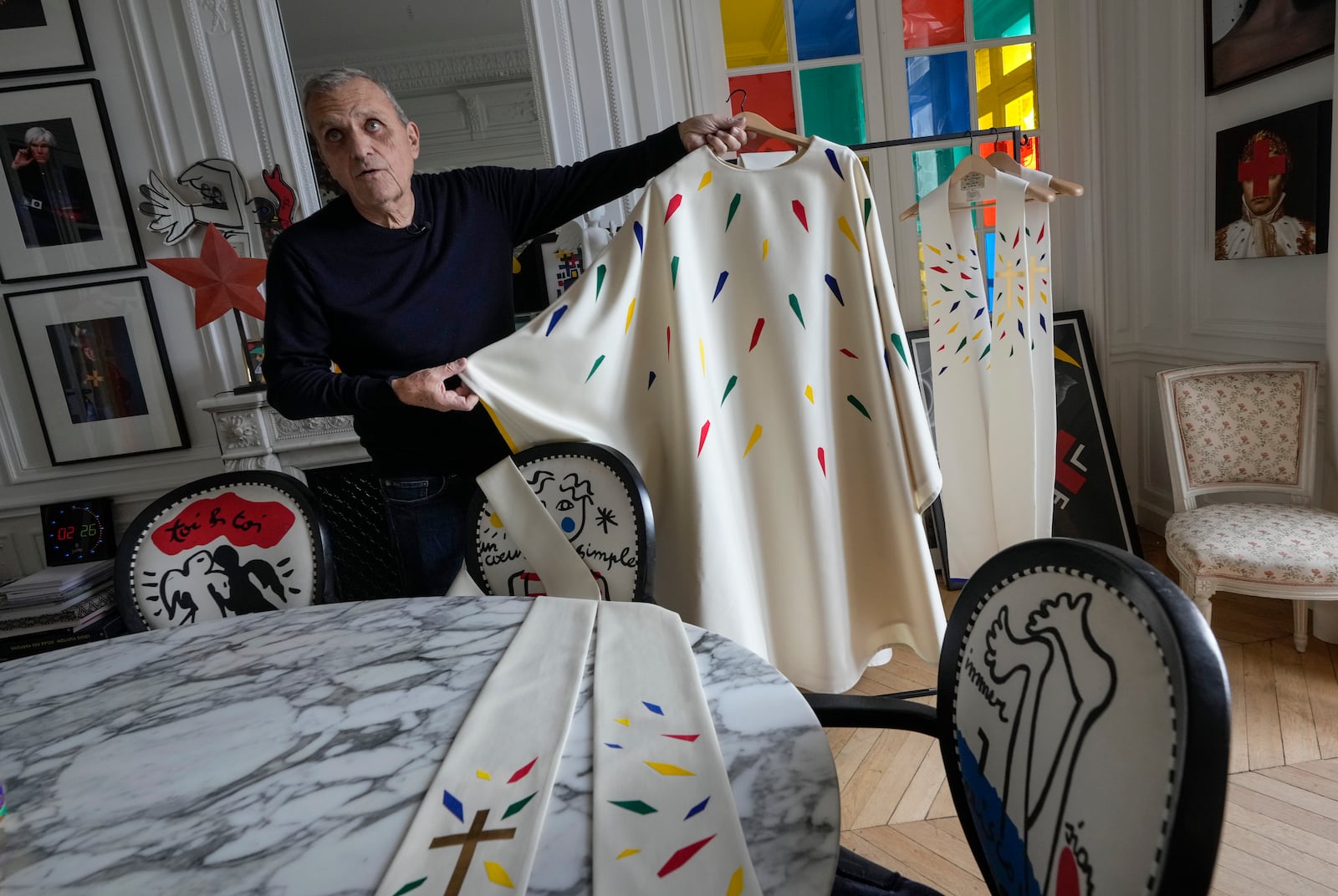 Designer Jean-Charles de Castelbajac displays a liturgical vestment for priests to be worn at the reopening of Paris' Notre-Dame cathedral in December, Wednesday, Nov. 20, 2024 in Paris. (AP Photo/Michel Euler)