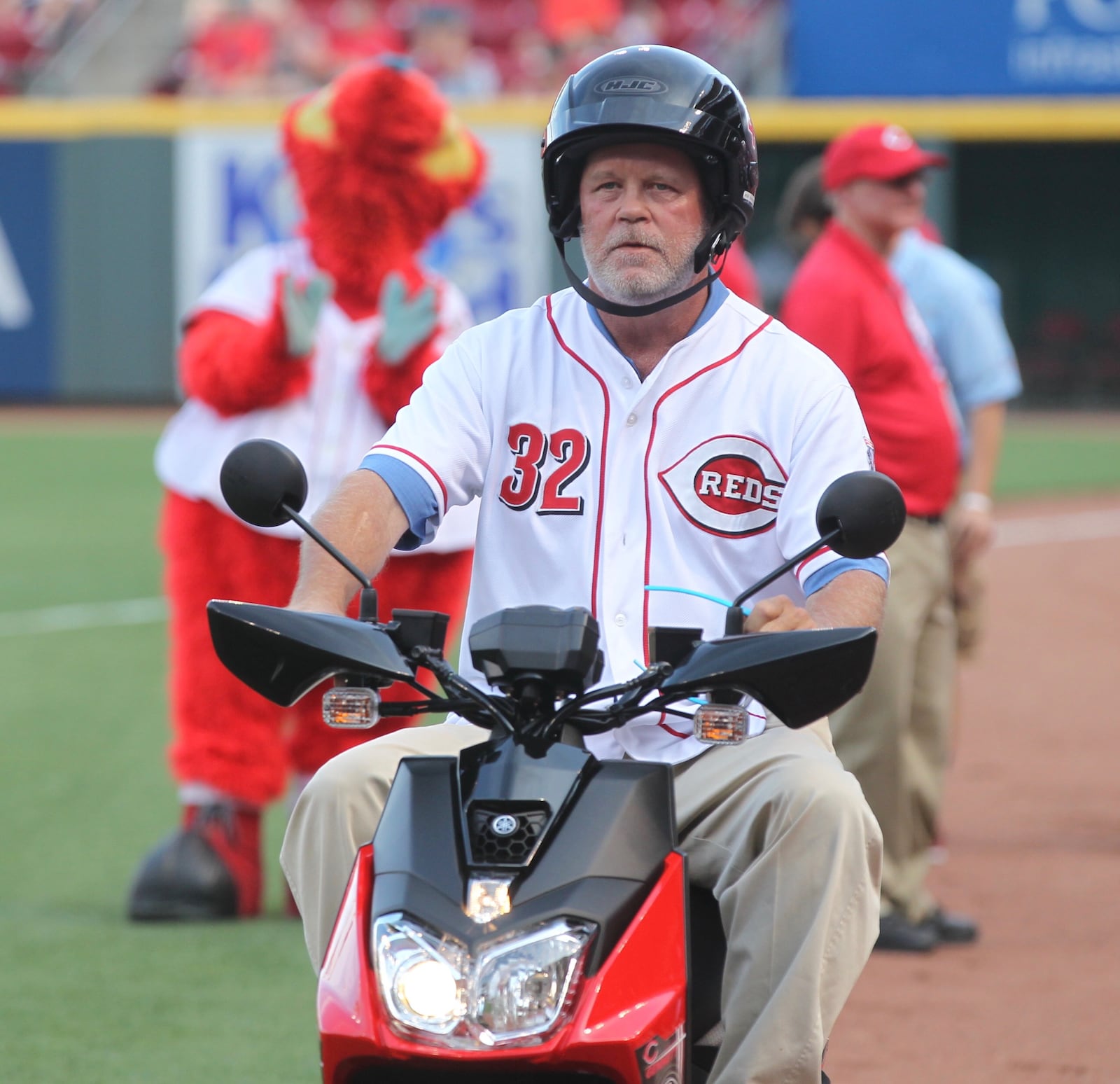 Tom Browning rides a scooter past the dugout at Great American Ball Park on Friday, June 16, 2017, in Cincinnati. Browning presented the scooter to Scooter Gennett.