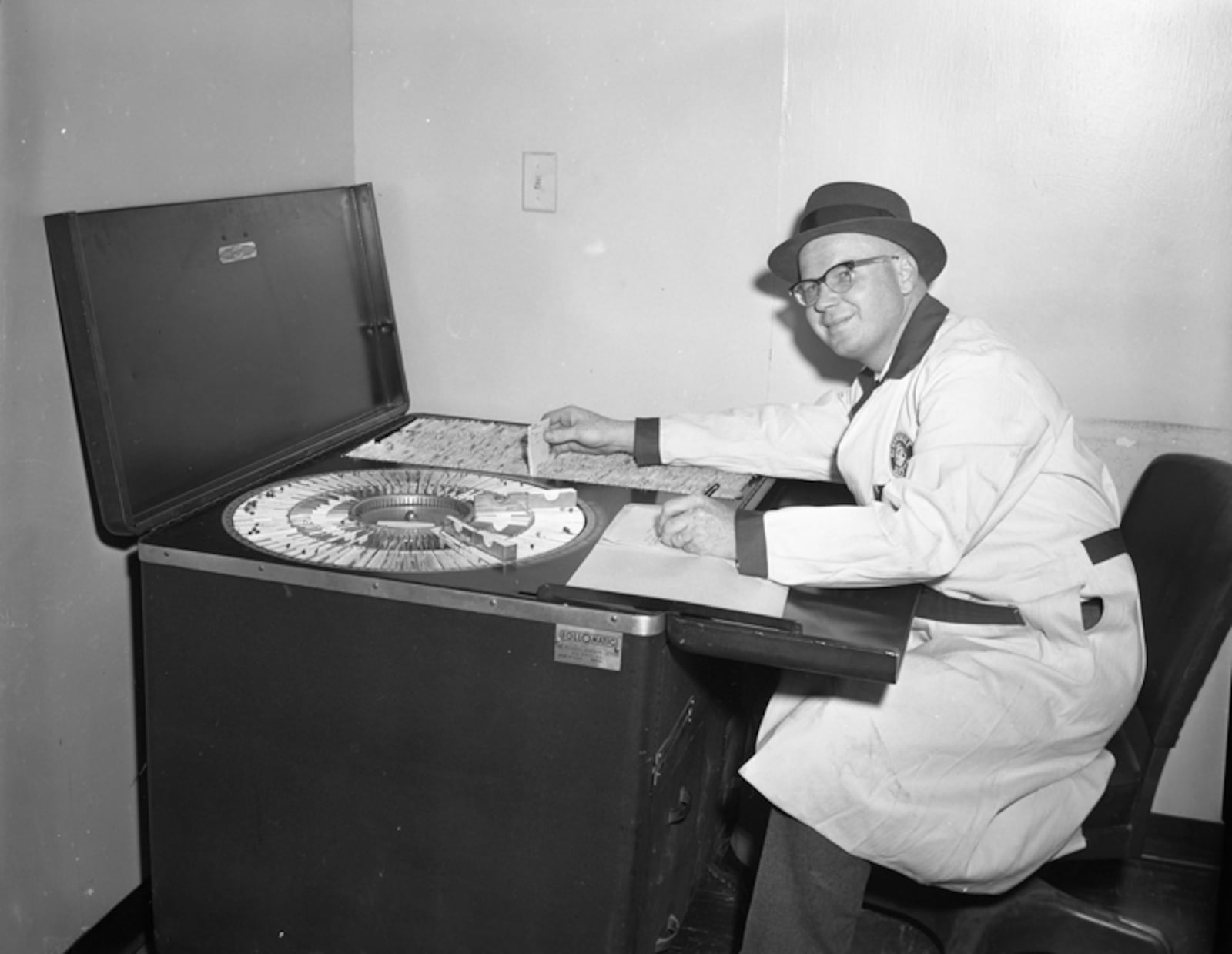 Employee using followmatic machine inside the Central Motors Building, November 2, 1960. From the collections of Dayton History.