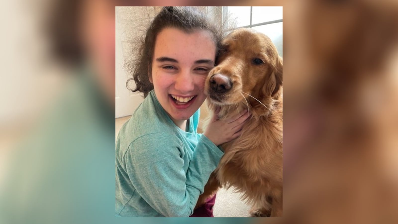 Mimi Sodano hugs her dog, Molly. Mimi requires specialized care because of a rare neurodevelopmental disorder. Photo provided by Lindsey Sodano.