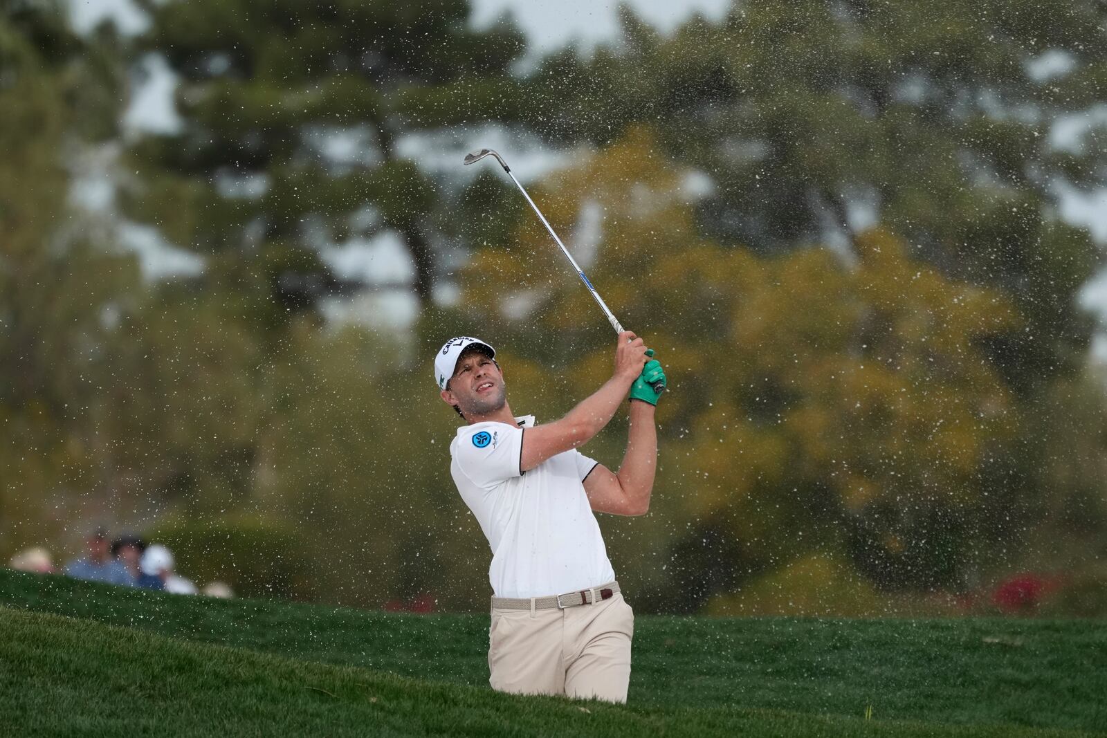 Thomas Detry, of Belgium, hits out of a fairway bunker at the second hole during the final round of the Phoenix Open golf tournament at TPC Scottsdale Sunday, Feb. 9, 2025, in Scottsdale, Ariz. (AP Photo/Ross D. Franklin)