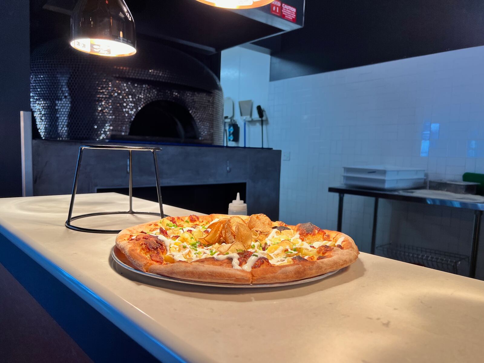 A pizza from the woodfire oven at The Foundry restaurant at the AC Hotel