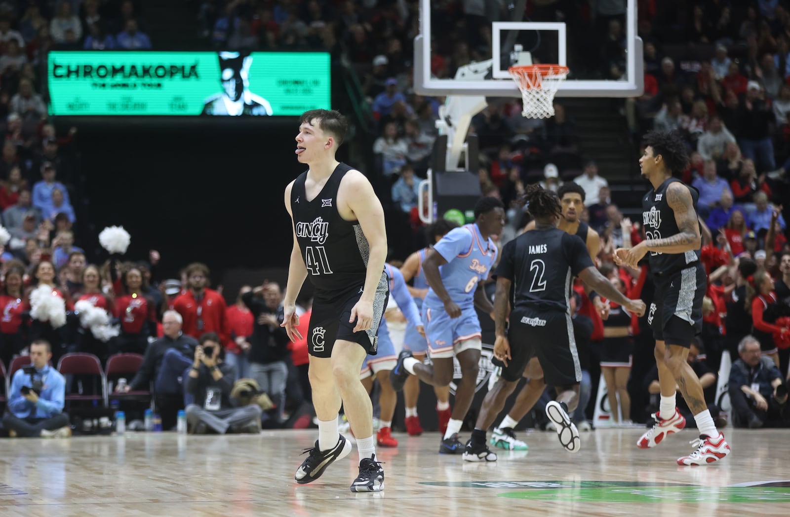 Cincinnati's Simas Lukosius reacts after making a 3-pointer against Dayton in the second half on Friday, Dec. 20, 2024, at the Heritage Bank Center in Cincinnati.