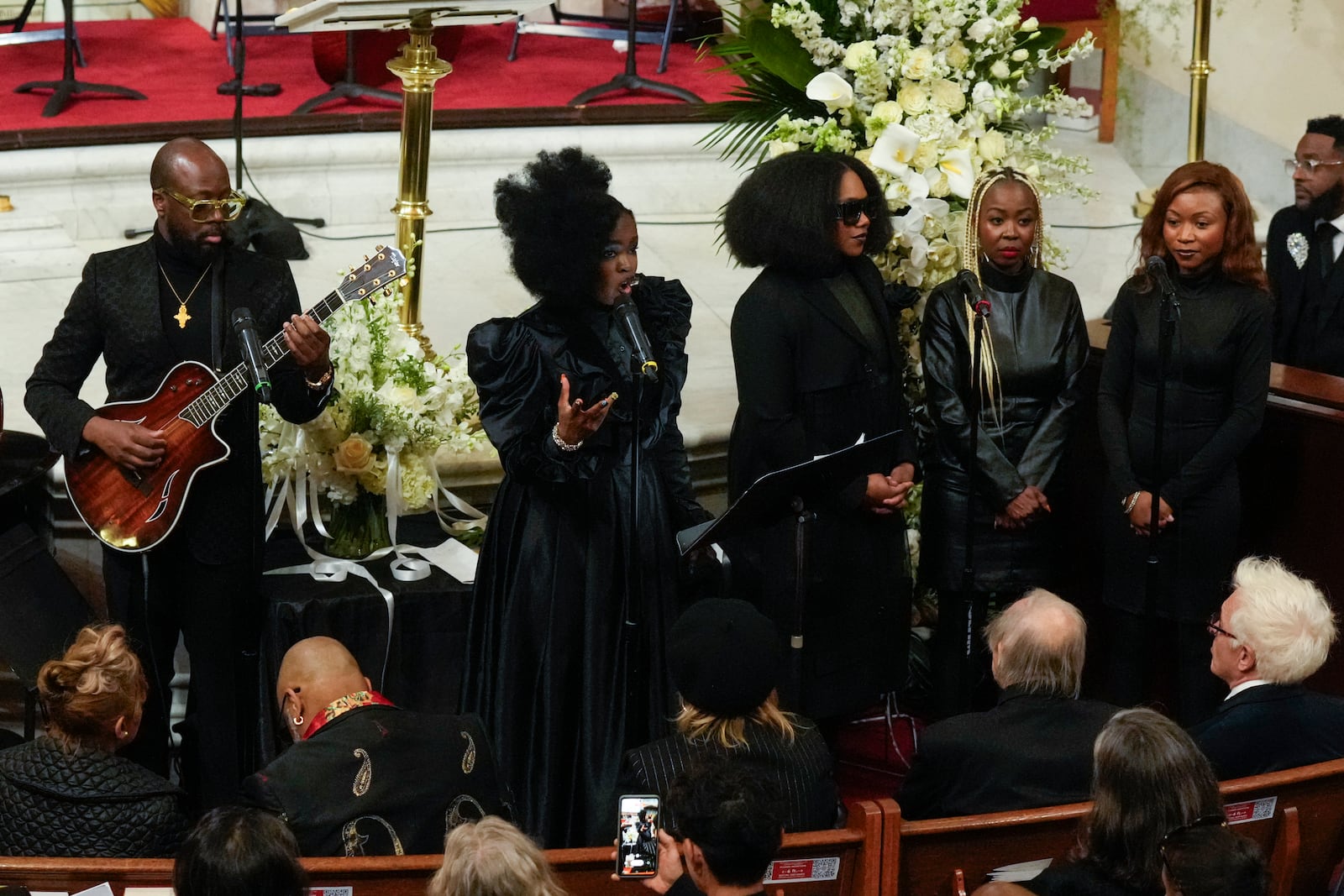 Wyclef Jean, left, and Lauryn Hill of the Fugees perform during a ceremony in celebration of Roberta Flack's life at The Abyssinian Baptist Church on Monday, March 10, 2025, in New York. (AP Photo/Richard Drew)