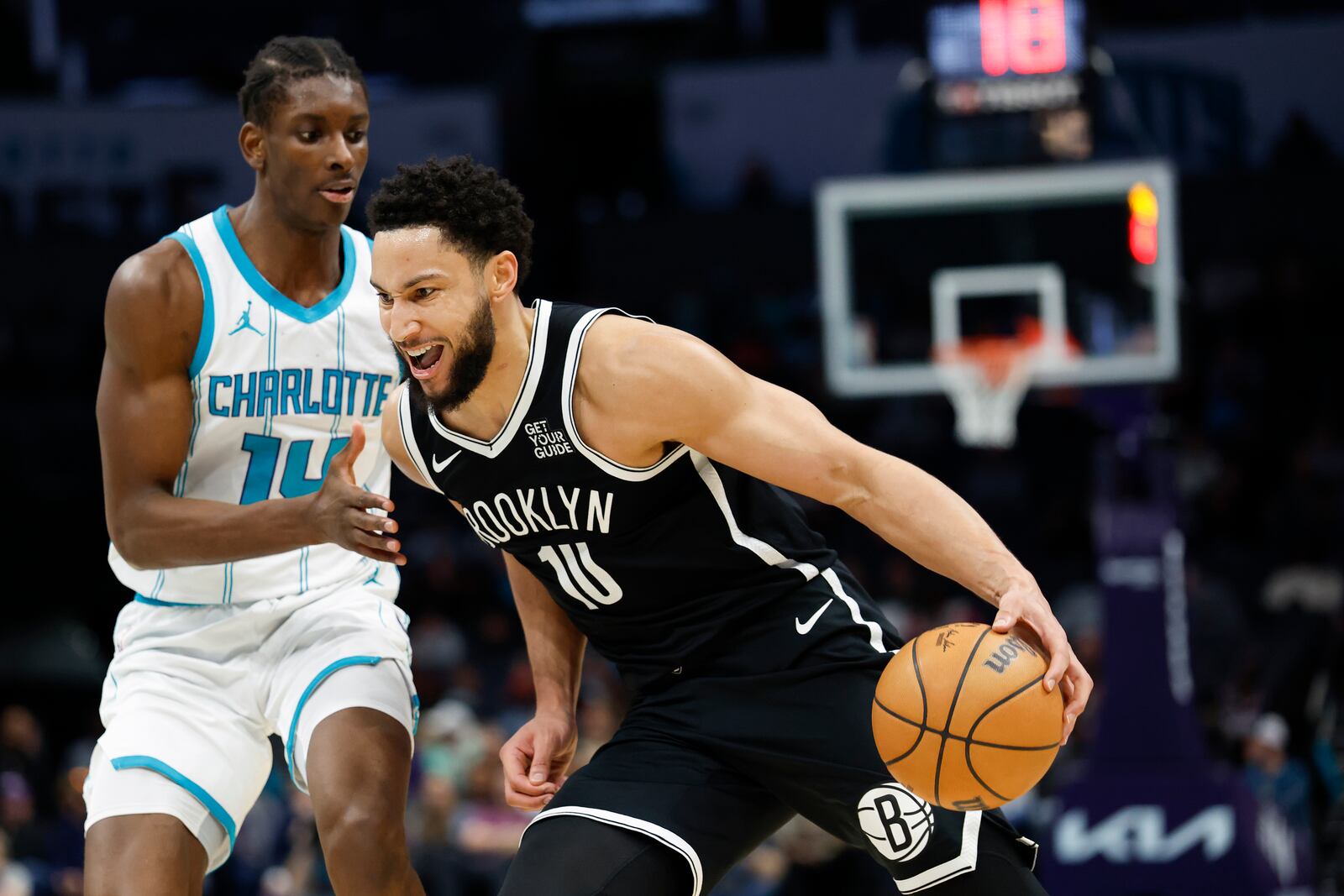 Brooklyn Nets guard Ben Simmons, right, drives past Charlotte Hornets forward Moussa Diabate during the second half of an NBA basketball game in Charlotte, N.C., Wednesday, Jan. 29, 2025. (AP Photo/Nell Redmond)