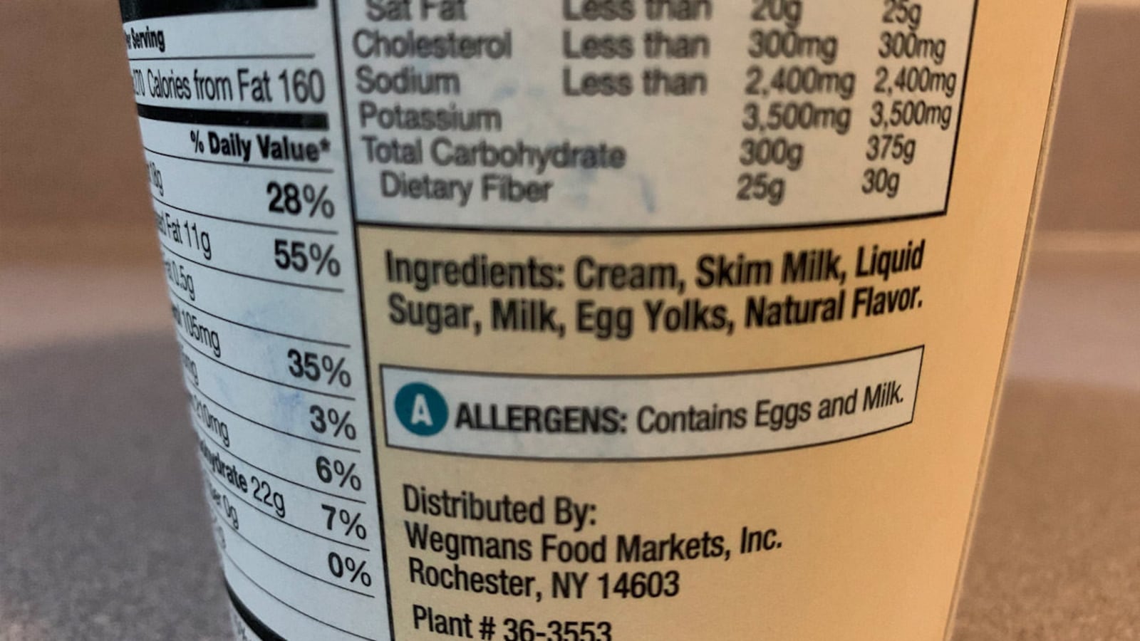 The list of ingredients on a pint of Wegmans vanilla ice cream.