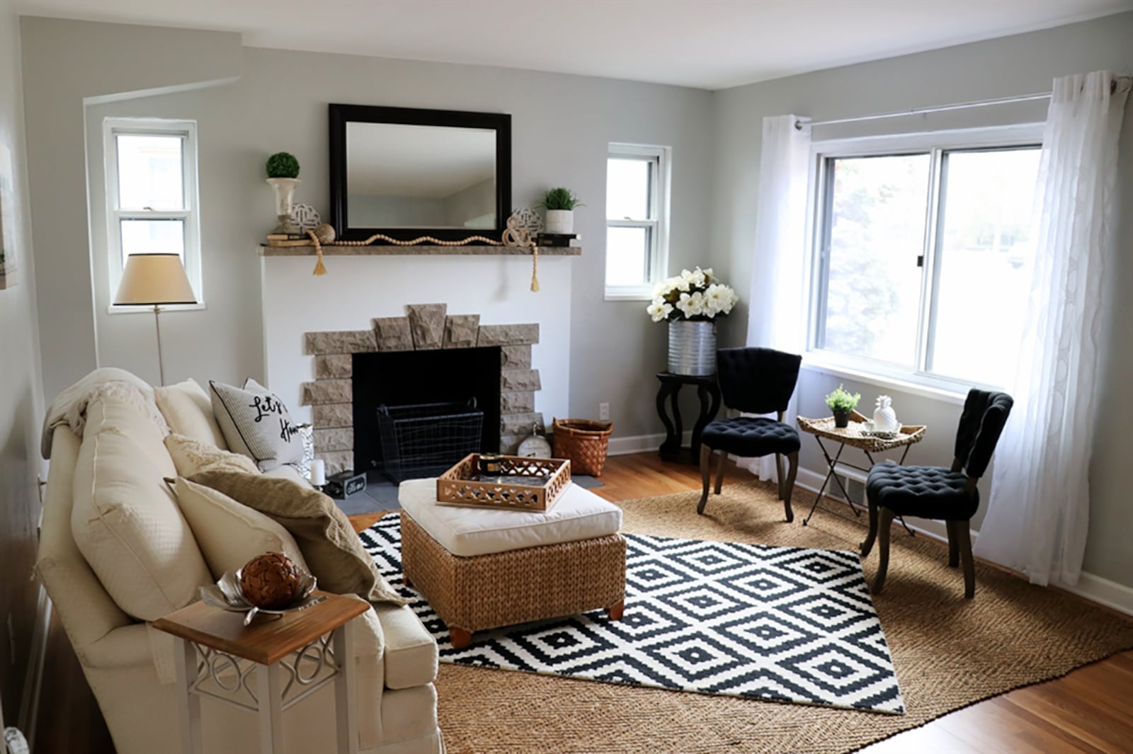 A stone fireplace with stone surround and mantle is the centerpiece to the living room yet can be enjoyed from the nearby dining area. CONTRIBUTED PHOTO BY KATHY TYLER