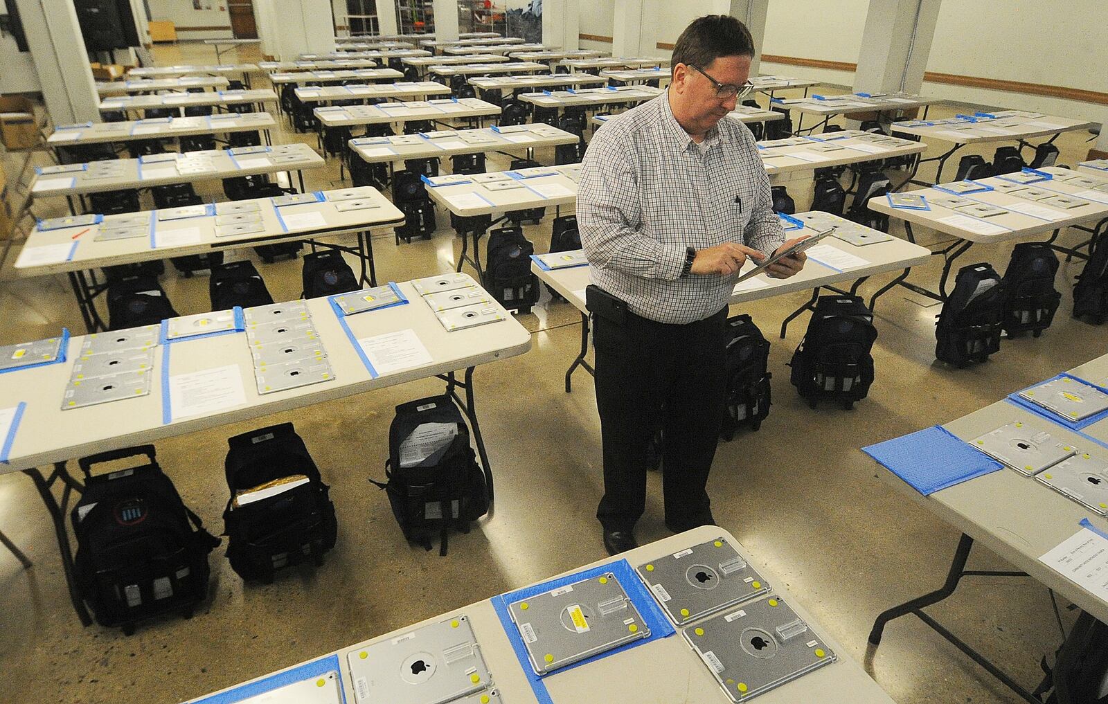 Jeff Rezabek, Director of the Montgomery County Board Elections, checks supervisor backpacks Monday Nov. 7, 2022 that are ready to go to polling locations for Tuesday's election. MARSHALL GORBY\STAFF