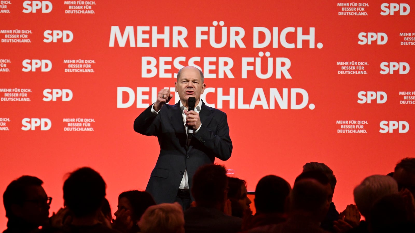 German Chancellor Olaf Scholz speaks on stage at the SPD's election campaign finale in the Westfalenhallen in Dortmund, Germany, Friday, Feb. 21, 2025. (Federico Gambarini/dpa via AP)