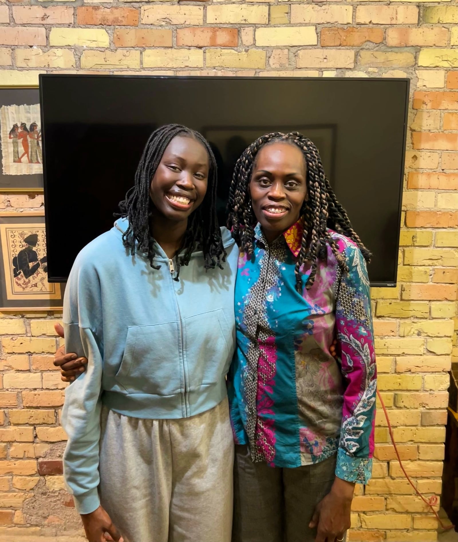 Dayton's Ajok Madol (left) and her mother, Abuk Akuei. CONTRIBUTED