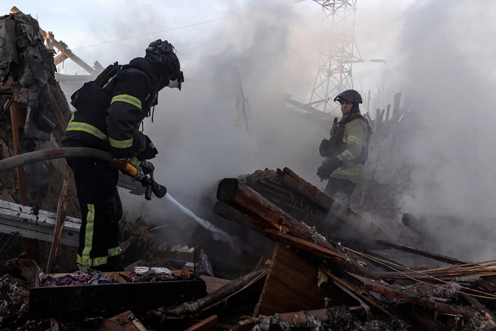 In this photo provided by the Ukrainian Emergency Service, firefighters put out the fire following a Russian air attack in Kostiantynivka, Donetsk region, Ukraine, Friday, March 7, 2025. (Ukrainian Emergency Service via AP)