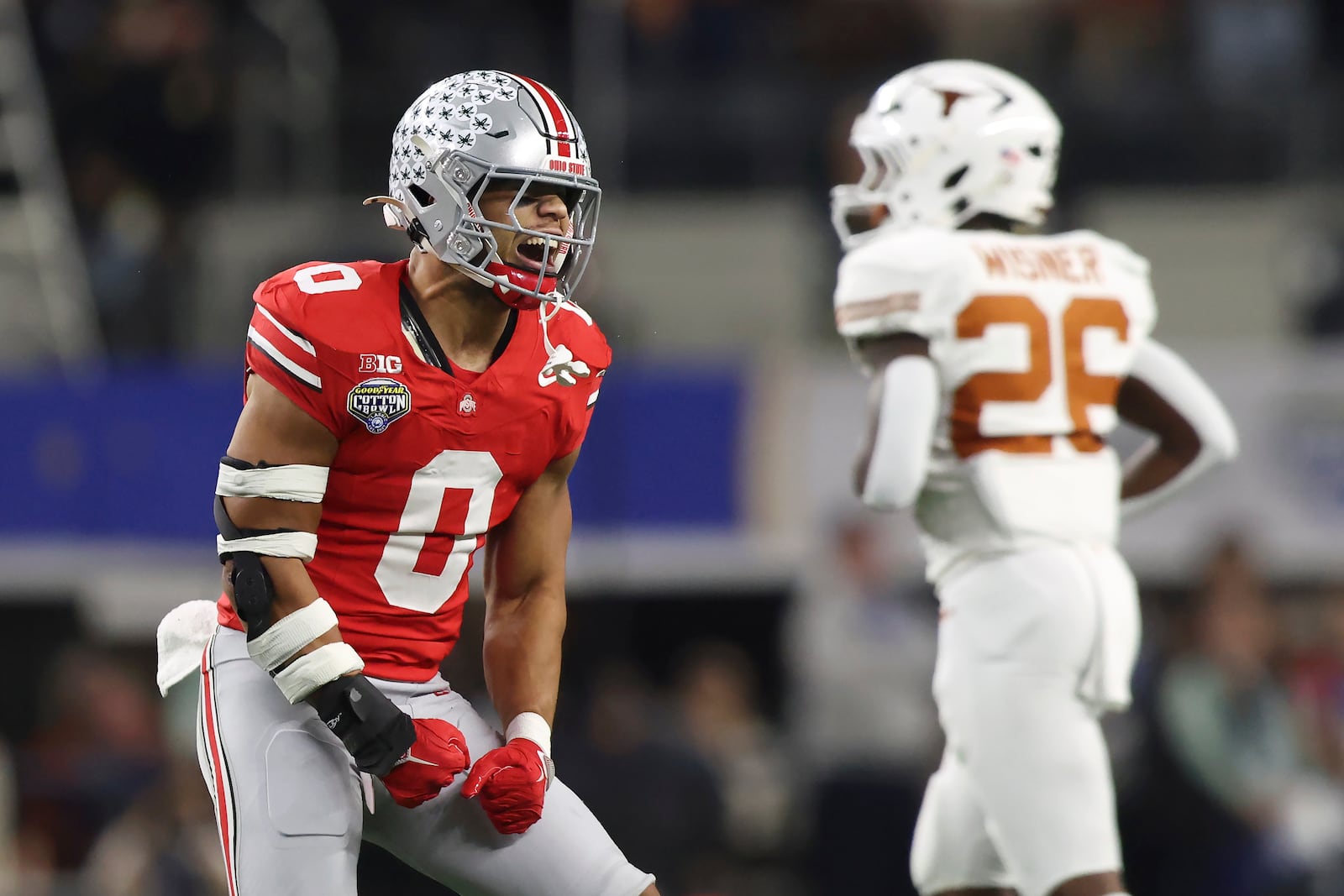 Ohio State linebacker Cody Simon (0) reacts after Texas quarterback Quinn Ewers threw an incomplete pass on fourth down during the first half of the Cotton Bowl College Football Playoff semifinal game, Friday, Jan. 10, 2025, in Arlington, Texas. (AP Photo/Gareth Patterson)