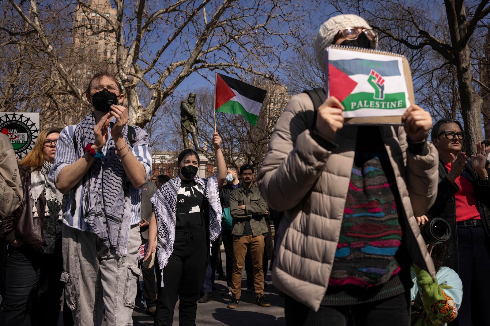 A protester including students of New York University gather for a demonstration in support of Palestinian activist Mahmoud Khalil at Washington Square Park, Tuesday, March 11, 2025, in New York. (AP Photo/Yuki Iwamura)