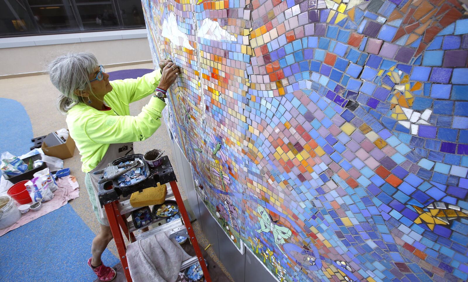 Mosaic artist Cynthia Fisher created large murals on the rooftop play areas with designs by patients and supporters of the hospital. Dayton Children’s is celebrating the completion of its $168 million new patient tower and campus renovation which started in 2014. TY GREENLEES / STAFF