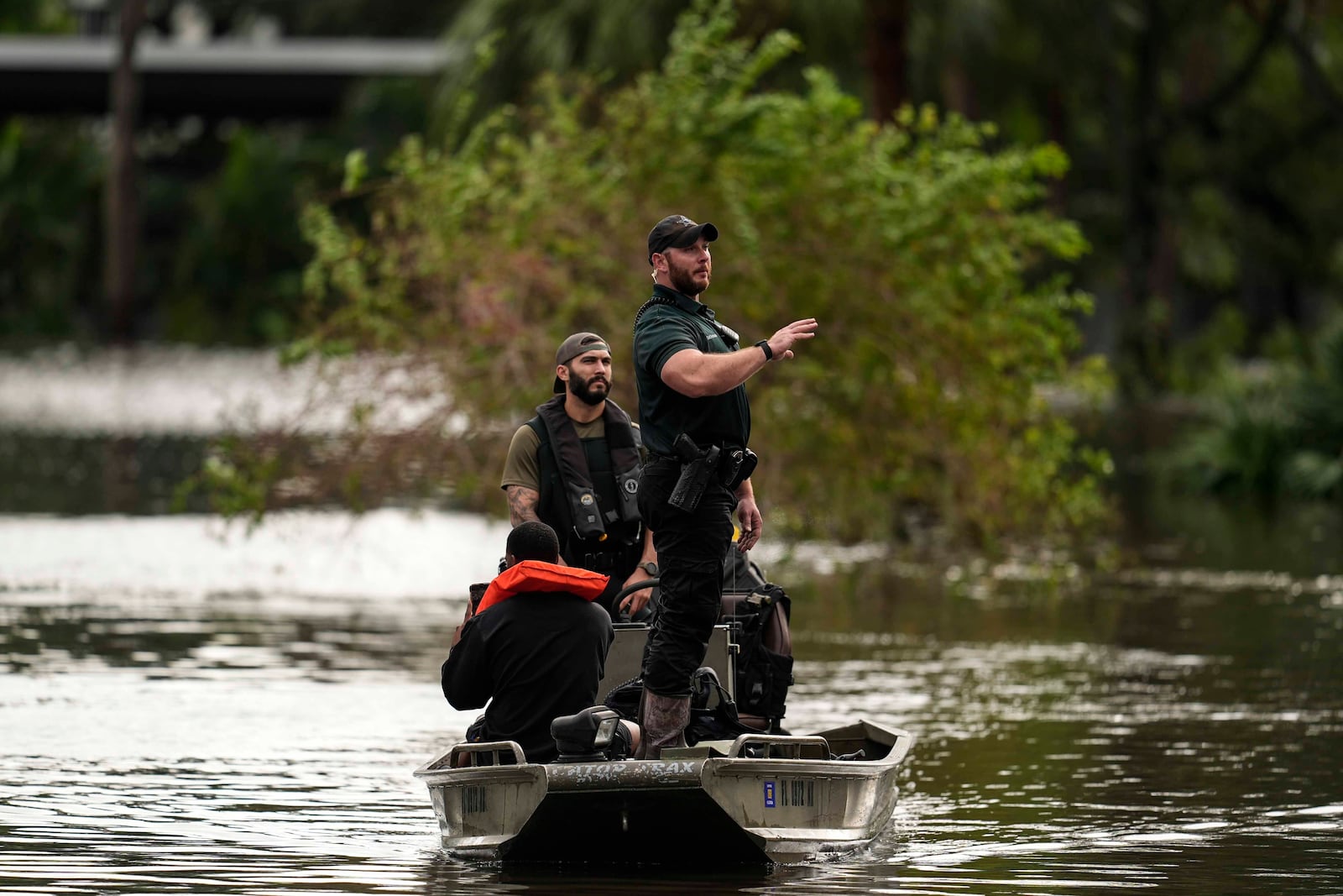 FILE - People are rescued from an apartment complex after flooding in the aftermath of Hurricane Milton, Oct. 10, 2024, in Clearwater, Fla. (AP Photo/Mike Stewart, File)