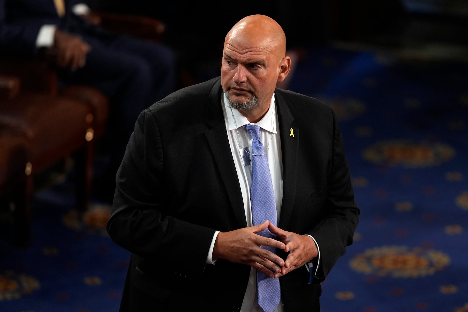 FILE - Sen. John Fetterman, D-Pa., wears a pendant in support of freeing hostages being held by Hamas home, before Israeli Prime Minister Benjamin Netanyahu speaks to a joint meeting of Congress at the Capitol in Washington, July 24, 2024. (AP Photo/Julia Nikhinson, File)