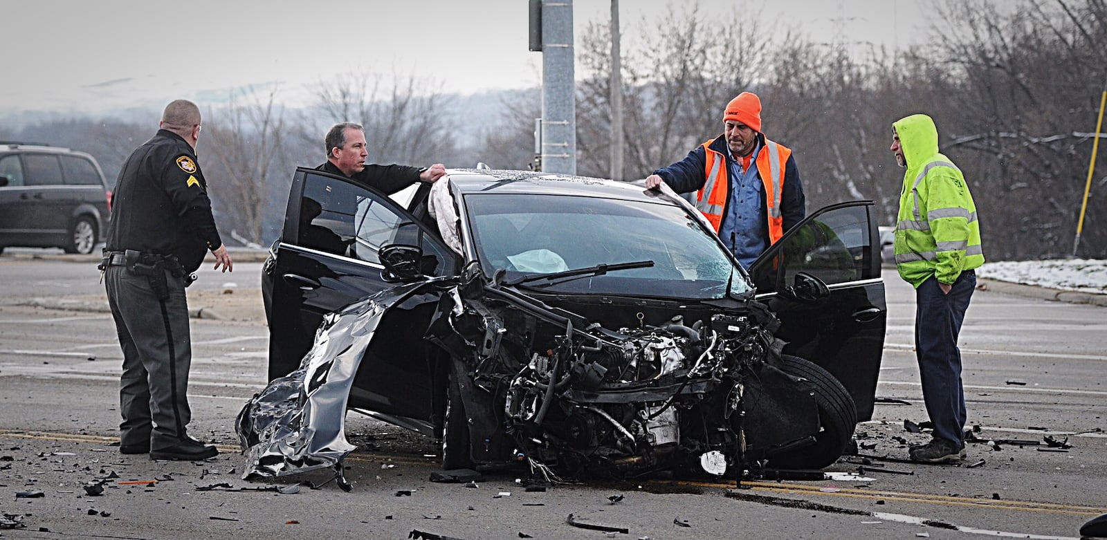 Two people fled, and one was taken into custody after a vehicle that was believed to have been involved in a shooting at a Miami Twp. hotel crashed in Moraine. (Marshall Gorby/Staff)