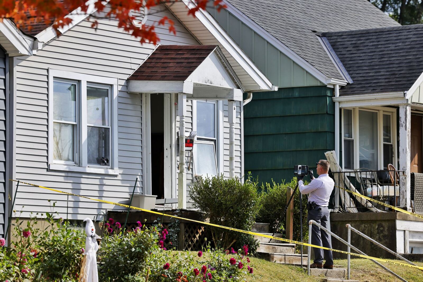 Hamilton police are investigating a death at a home in the 1200 block of Parrish Avenue. Pictured are investigators at the home on Oct. 11, 2022. NICK GRAHAM/STAFF