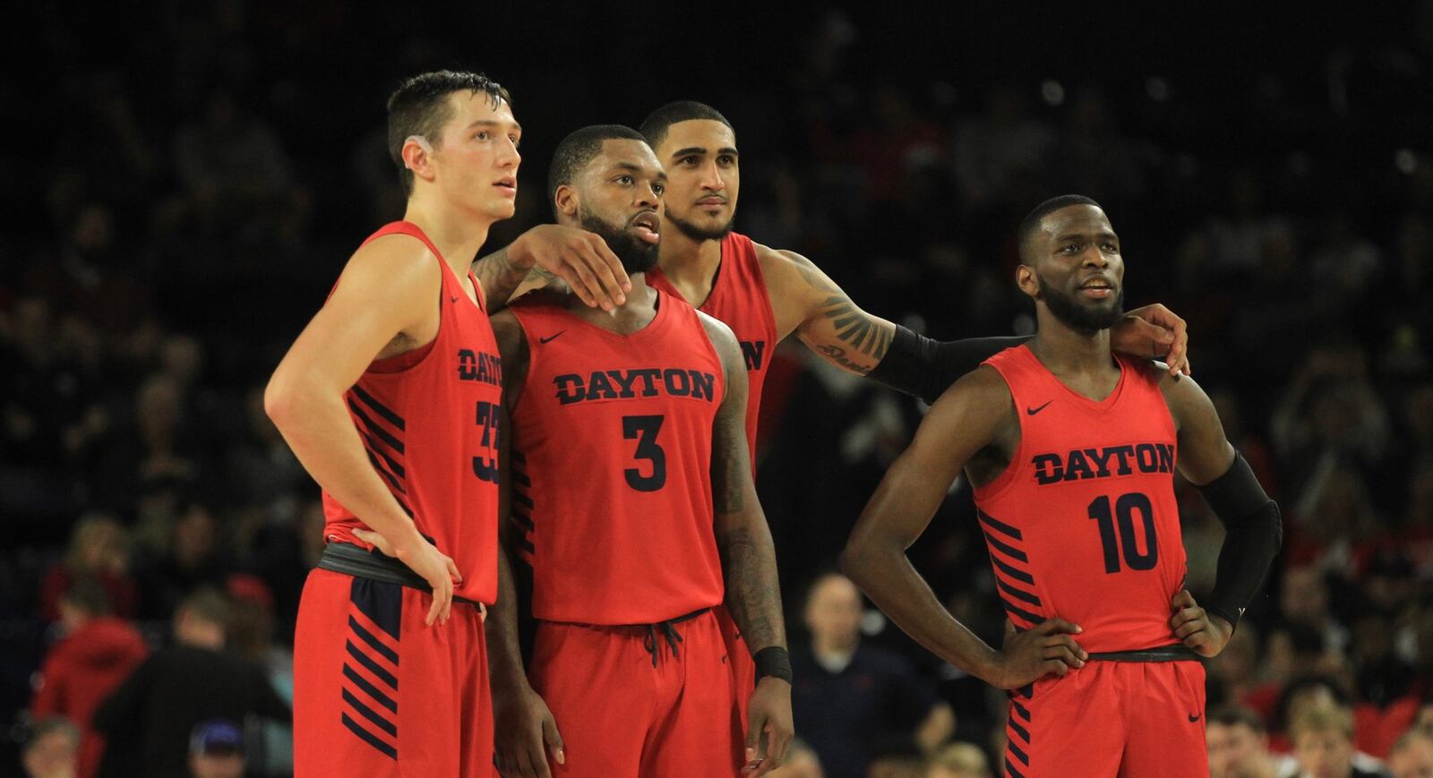 Dayton players (left to right) Ryan Mikesell, Trey Landers, Obi Toppin and Jalen Crutcher watch Ibi Watson shoot a free throw against Richmond on Saturday, Jan. 25, 2020, at the Robins Center in Richmond, Va. David Jablonski/Staff