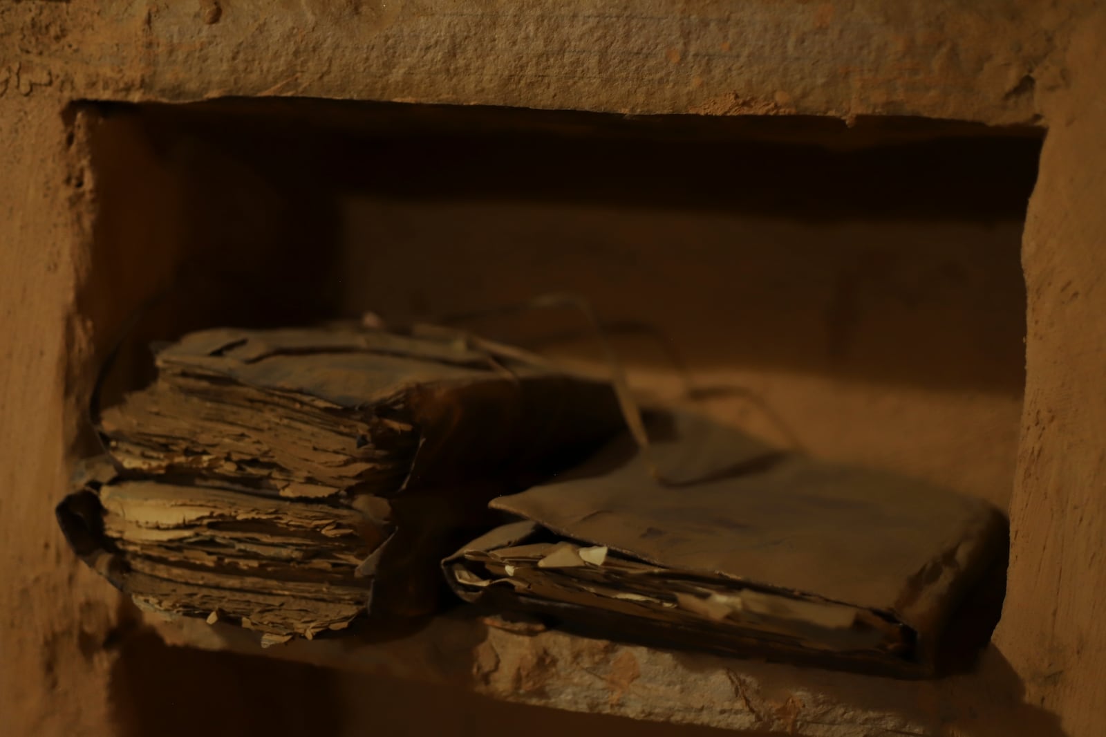 Manuscripts sit on a shelf inside one of the libraries in Chinguetti, Mauritania on Feb. 3, 2025. (AP Photo/Khaled Moulay)