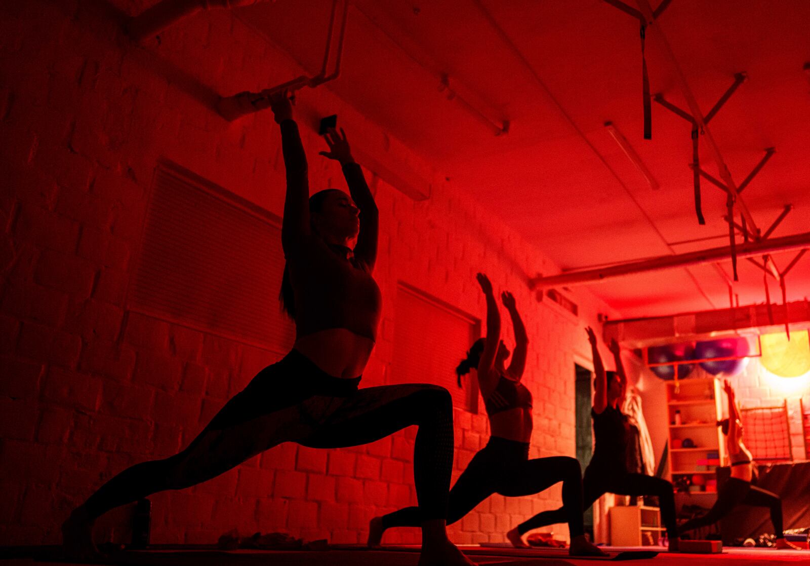 FILE - Women attend a yoga master class at Shogun sports center in Kyiv, Ukraine on Nov. 29, 2024. (AP Photo/Evgeniy Maloletka, File)