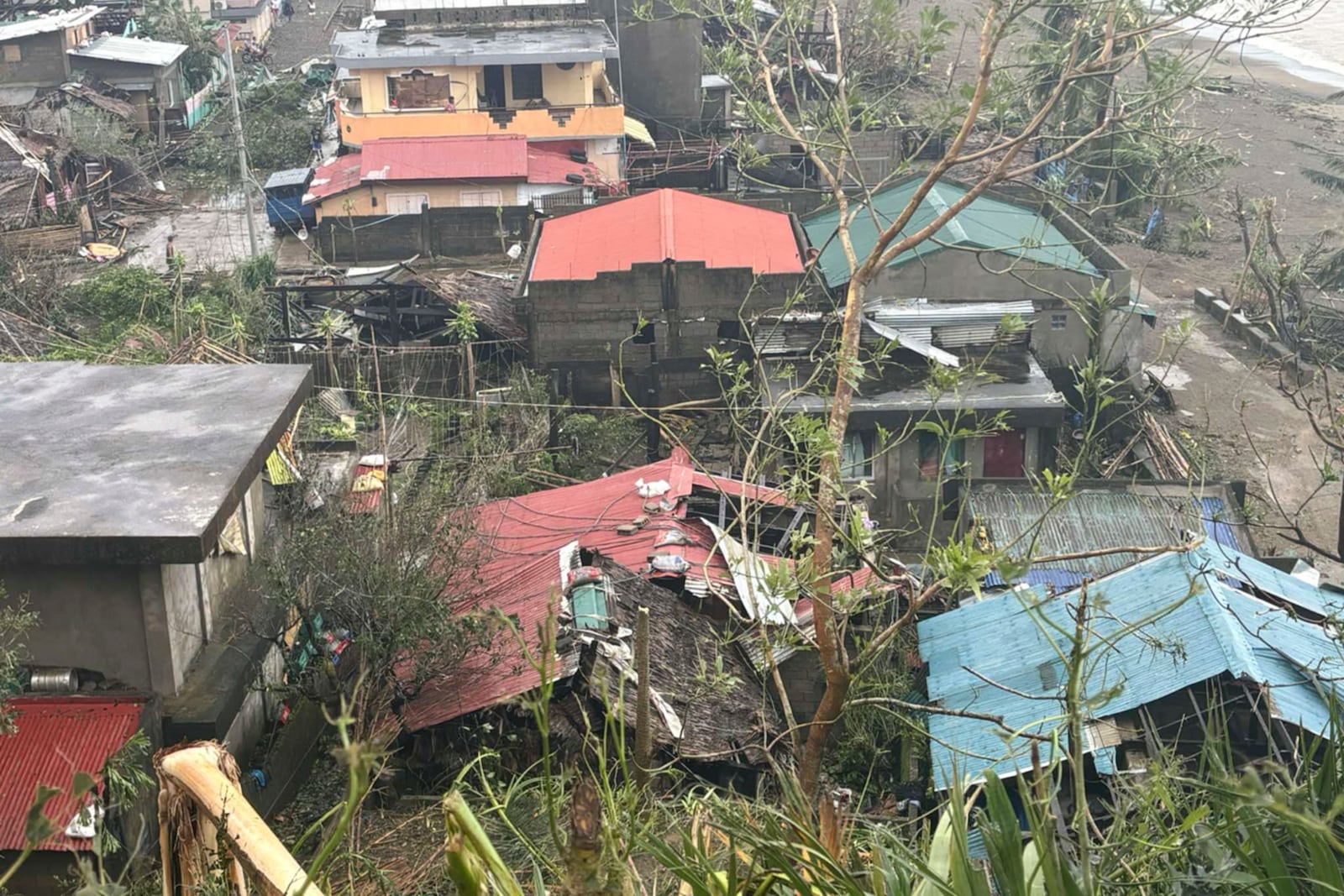 This photo provided by the MDRRMO Viga Catanduanes, shows damaged houses caused by Typhoon Man-yi in Viga, Catanduanes province, northeastern Philippines Sunday, Nov. 17, 2024. (MDRRMO Viga Catanduanes via AP)