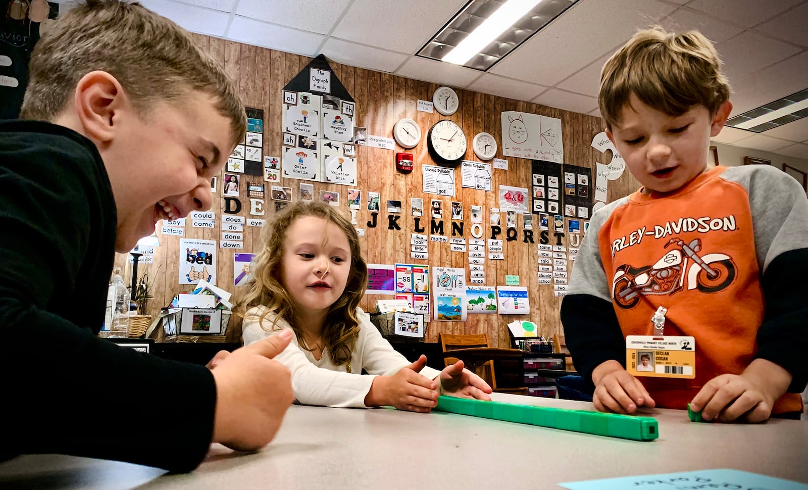 First-grade students, left to right Parker Richey, Remi Kinney, and Declan Cogan in Sarah Jacobs math class work on counting skills Monday, April 22, 2024 at the Primary Village North school in Centerville.  MARSHALL GORBY\STAFF