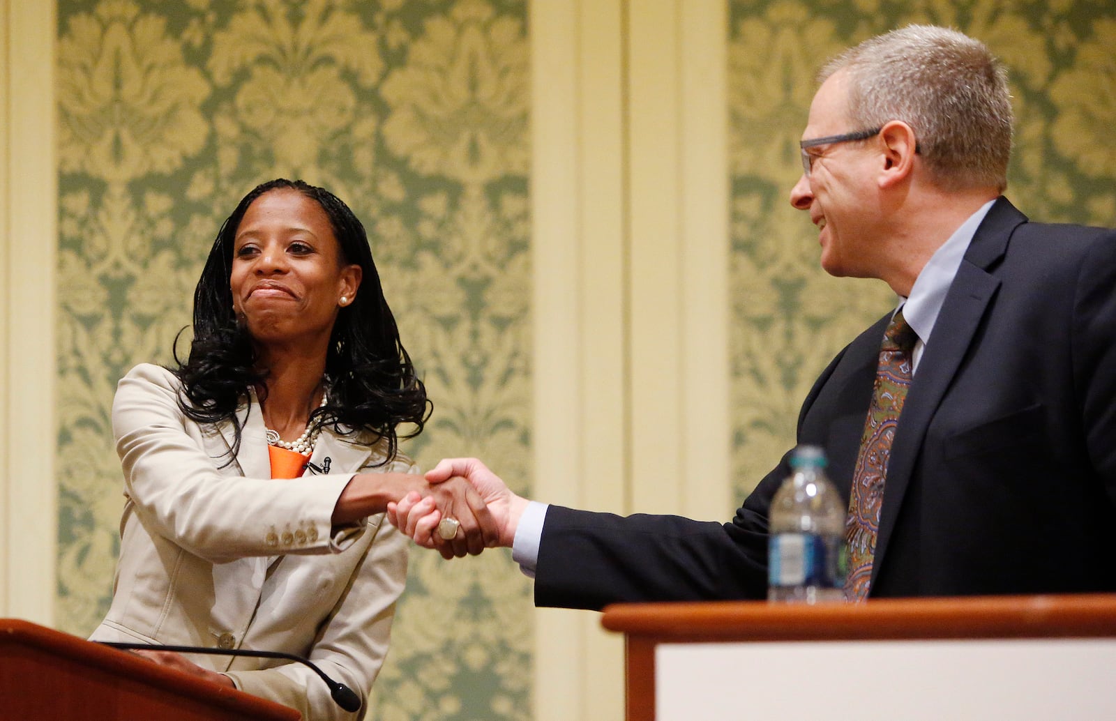 FILE - Republican Mia Love and Democrat Doug Owens shake hands after a debate in Salt Lake City, May 20, 2014. (Jeffrey D. Allred/The Deseret News via AP, File)