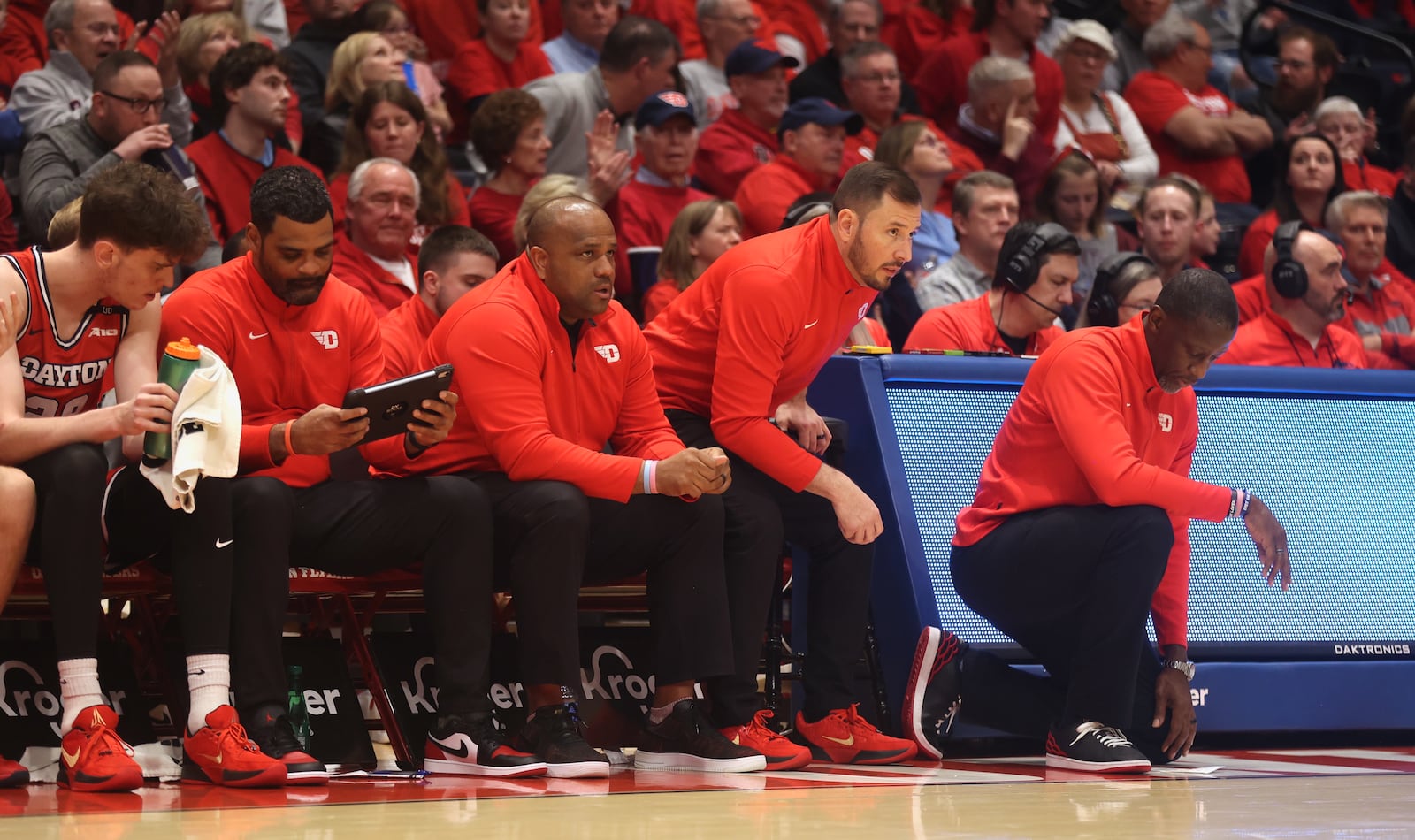 Dayton coaches, including Anthony Grant, right, watch the action late in the second half against Virginia Commonwealth on Friday, Feb. 7, 2025, at UD Arena.. David Jablonski/Staff