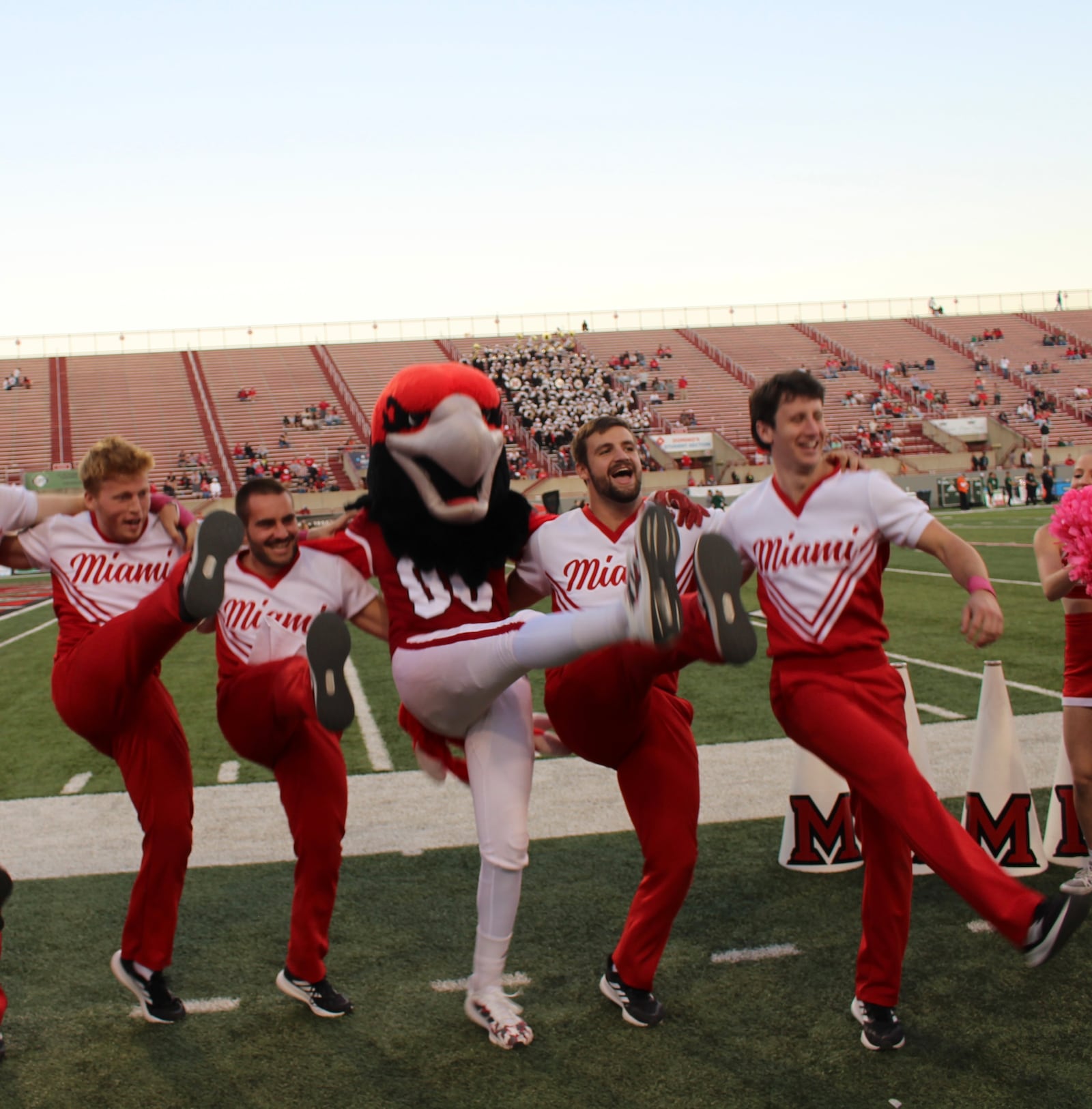 Four members of Miami University’s cheerleading squad say they are being helped by their shared major of study – engineering – during their energetic and complex routines during games. Left to right are Bryan Dick, Braden Cowger, Evan Conley and Gabe Gabrovsek. (Provided)