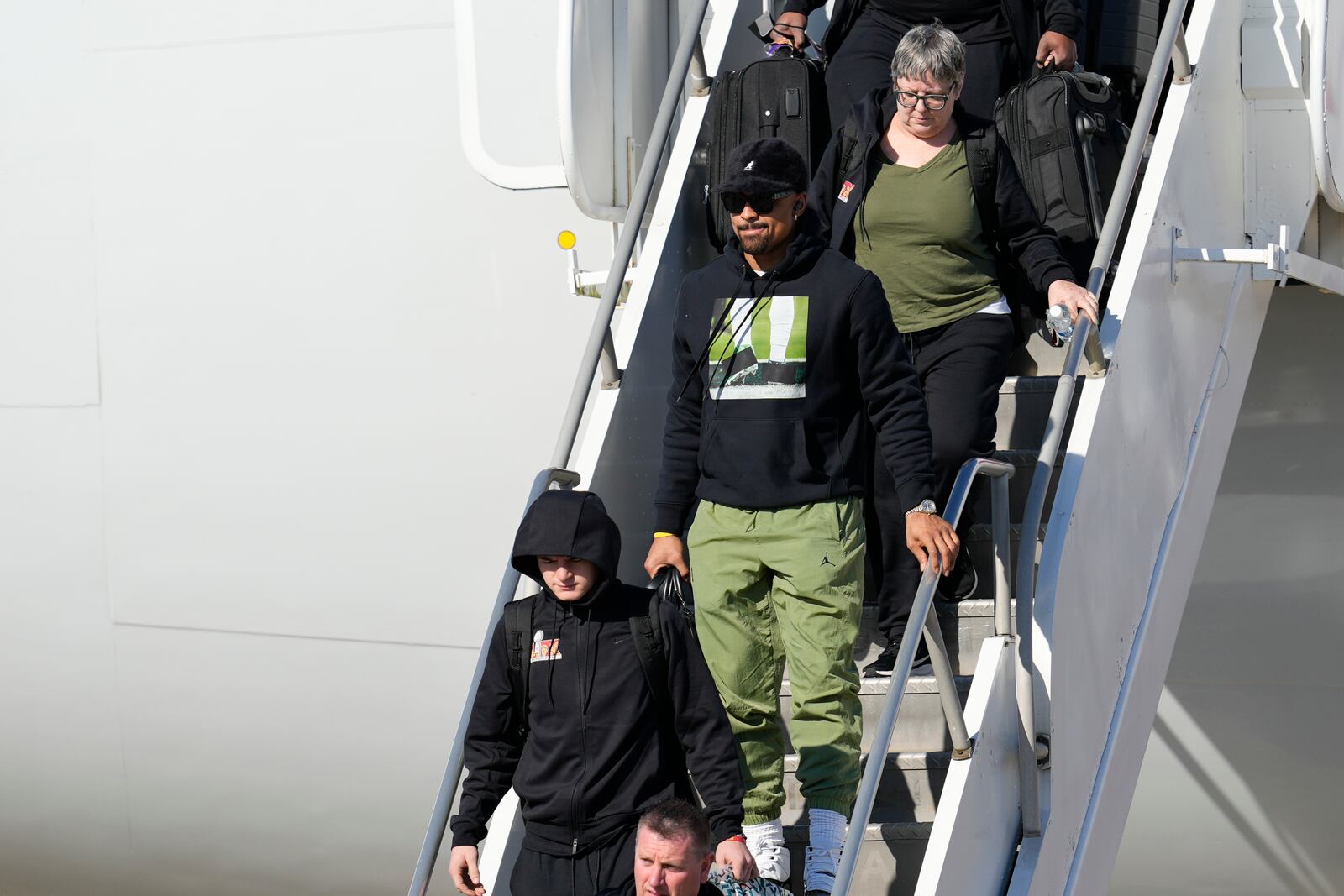 Philadelphia Eagles quarterback Jalen Hurts (1) arrives at New Orleans international airport, Sunday, Feb. 2, 2025, in Kenner, La. ahead of the NFL Super Bowl 59 football game between the Philadelphia Eagles and the Kansas City Chiefs. (AP Photo/David J. Phillip)