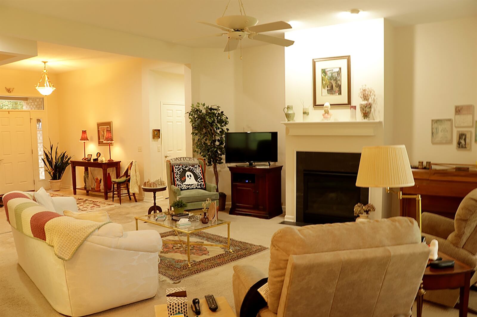 A gas-log fireplace is the focal point to the great room as it has a black granite surround and fluted wood mantel. A picture window looks out along the back yard and ninth fairway. CONTRIBUTED PHOTO BY KATHY TYLER