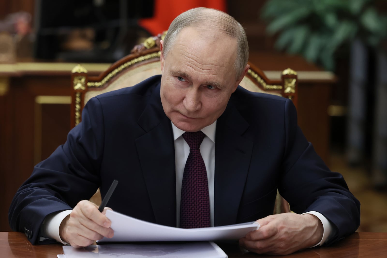 Russian President Vladimir Putin listens to the Head of Republic of Tatarstan Rustam Minnikhanov during their meeting at the Kremlin in Moscow, Russia, Monday, March 3, 2025. (Mikhail Metzel, Sputnik, Kremlin Pool Photo via AP)