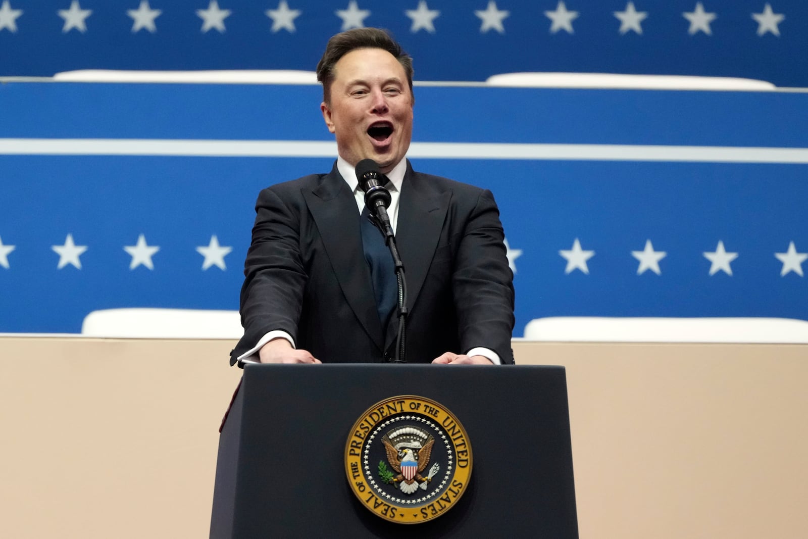 Elon Musk speaks at an indoor Presidential Inauguration parade event in Washington, Monday, Jan. 20, 2025. (AP Photo/Matt Rourke)