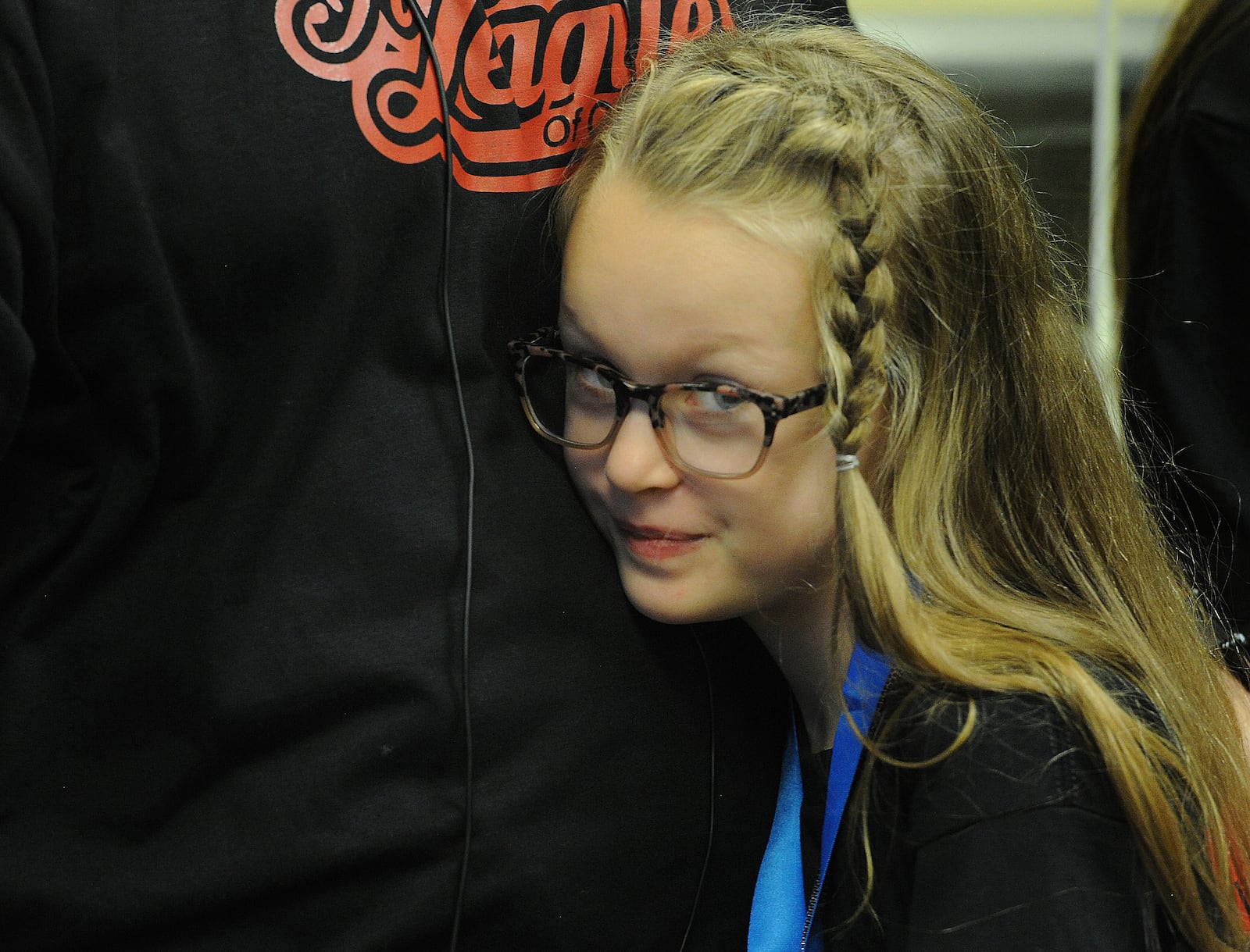 Peggy Henderson acts a little shy after being adopted by the Henderson family on National Adoption Day at the Montgomery County Probate Court, Friday Nov. 18, 2022. MARSHALL GORBY\STAFF