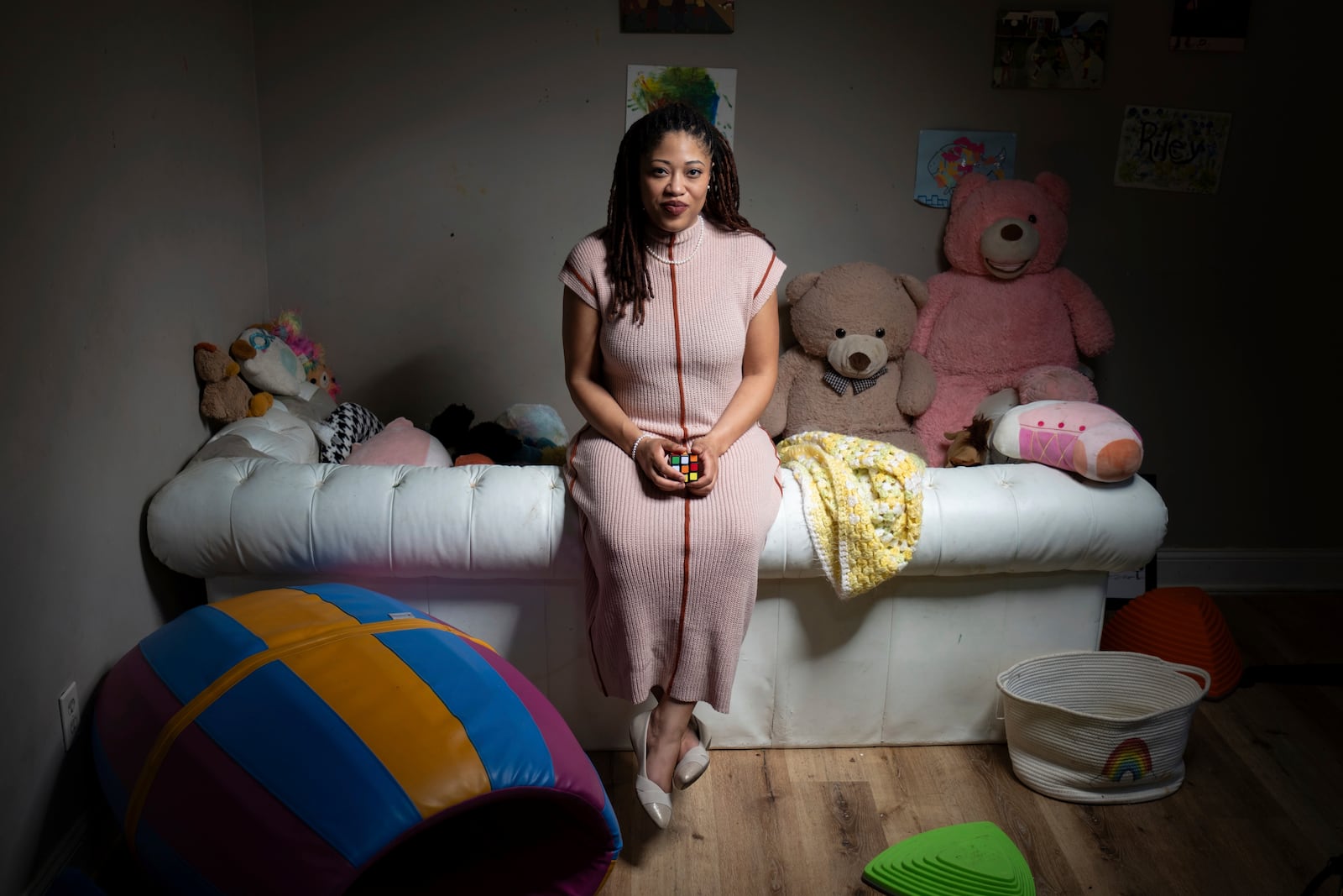 Natasha Nelson, who was diagnosed with autism in August 2023, just after her youngest daughter was also diagnosed, sits in a sensory room she uses to calm her children in her Stone Mountain, Ga. home on Friday, Feb. 14, 2025. (AP Photo/Ben Gray)