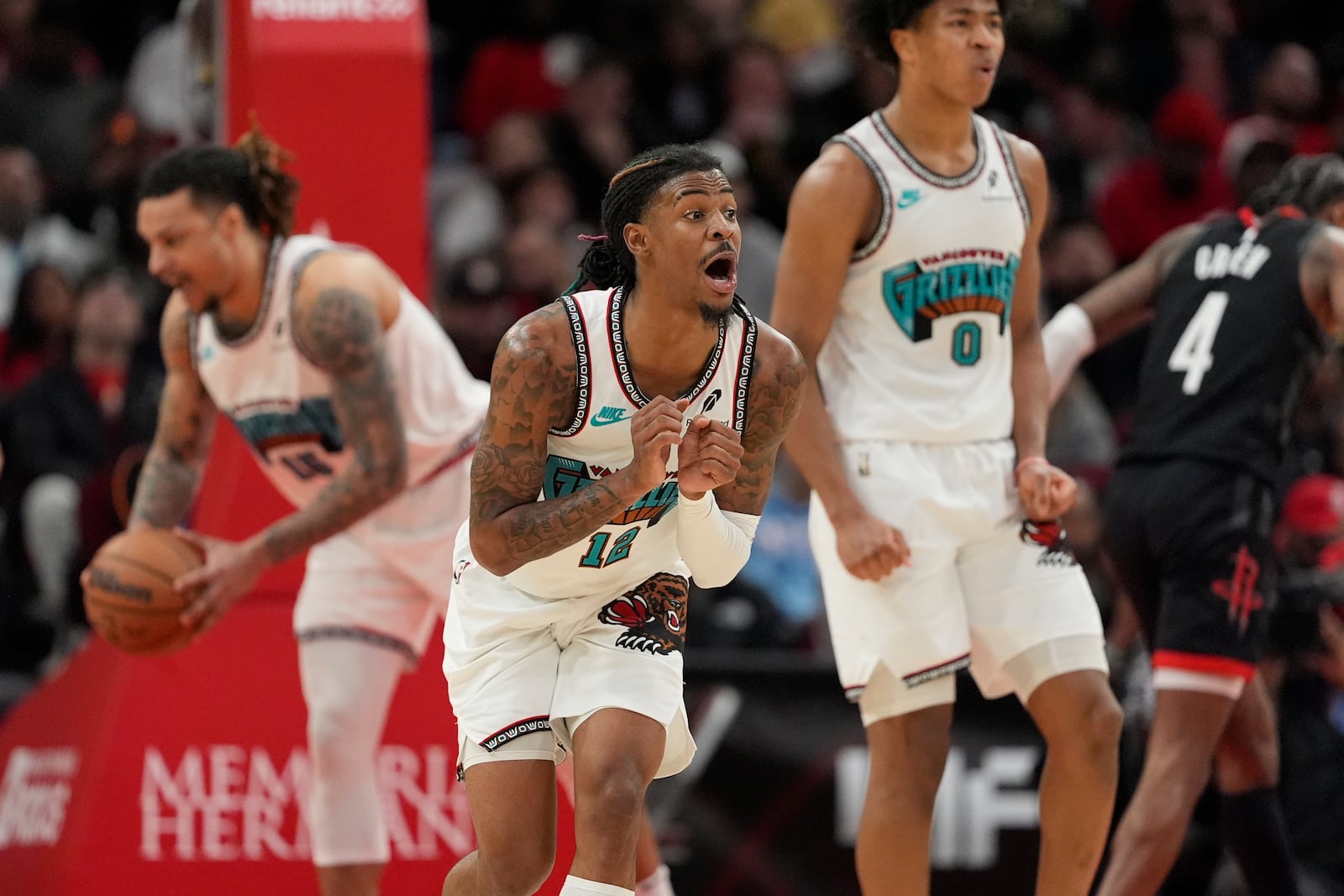 Memphis Grizzlies' Ja Morant (12) reacts after being called for a foul against the Houston Rockets during the second half of an NBA basketball game Monday, Jan. 13, 2025, in Houston. The Rockets won 120-118. (AP Photo/David J. Phillip)