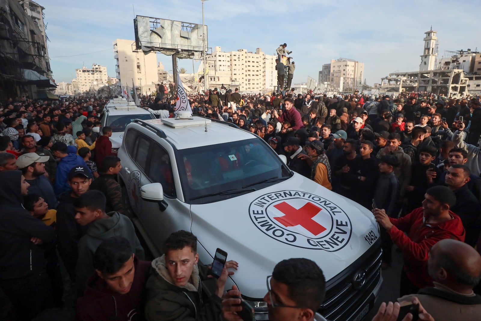 A Red Cross convoy arrives to collect Israeli hostages released after a ceasefire agreement between Israel and Hamas took effect, in Gaza City Sunday, Jan. 19, 2025. (AP Photo/Abed Hajjar)