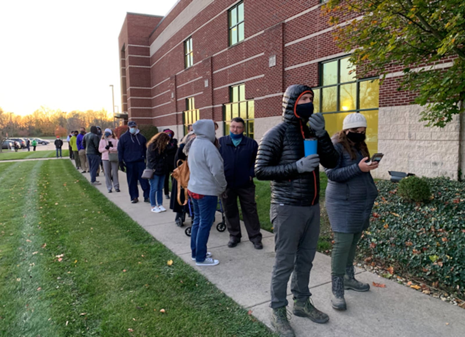 About a hundred people were lined up at Sinclair Community College South Campus waiting to polls to open on Election Day. It is the only polling place in Montgomery County with six precincts. STAFF PHOTO / JORDAN LAIRD