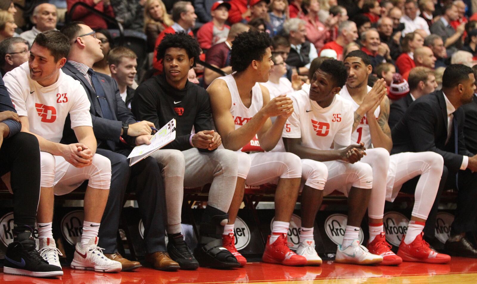 Dayton’s Jhery Matos, third from left, sits on the bench during a game against Mississippi State on Friday, Nov. 30, 2018, at UD Arena.