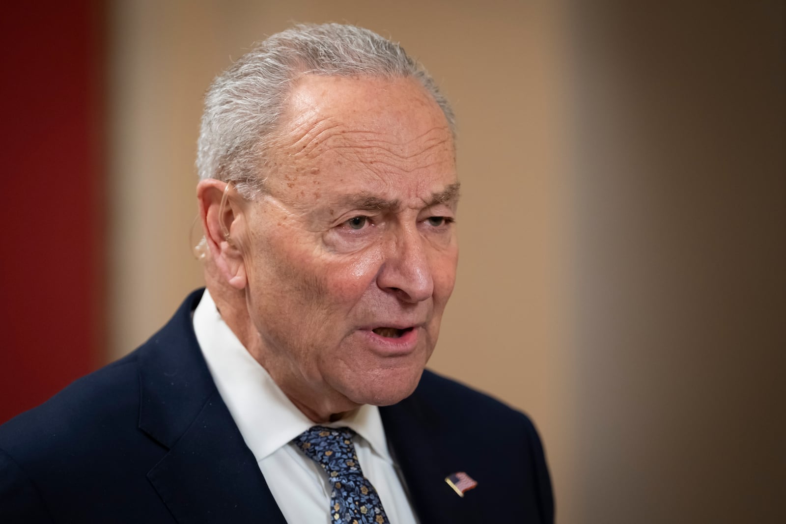 Senate Democratic Leader Chuck Schumer gives a television interview, at the Capitol in Washington, Friday, March 14, 2025. (AP Photo/Ben Curtis)