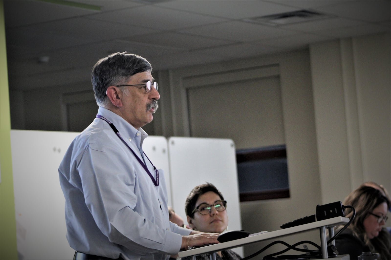 William Troy, a local resident, discusses storm water concerns about the site of a proposed Maronda Homes housing project in northeast Dayton. CORNELIUS FROLIK / STAFF