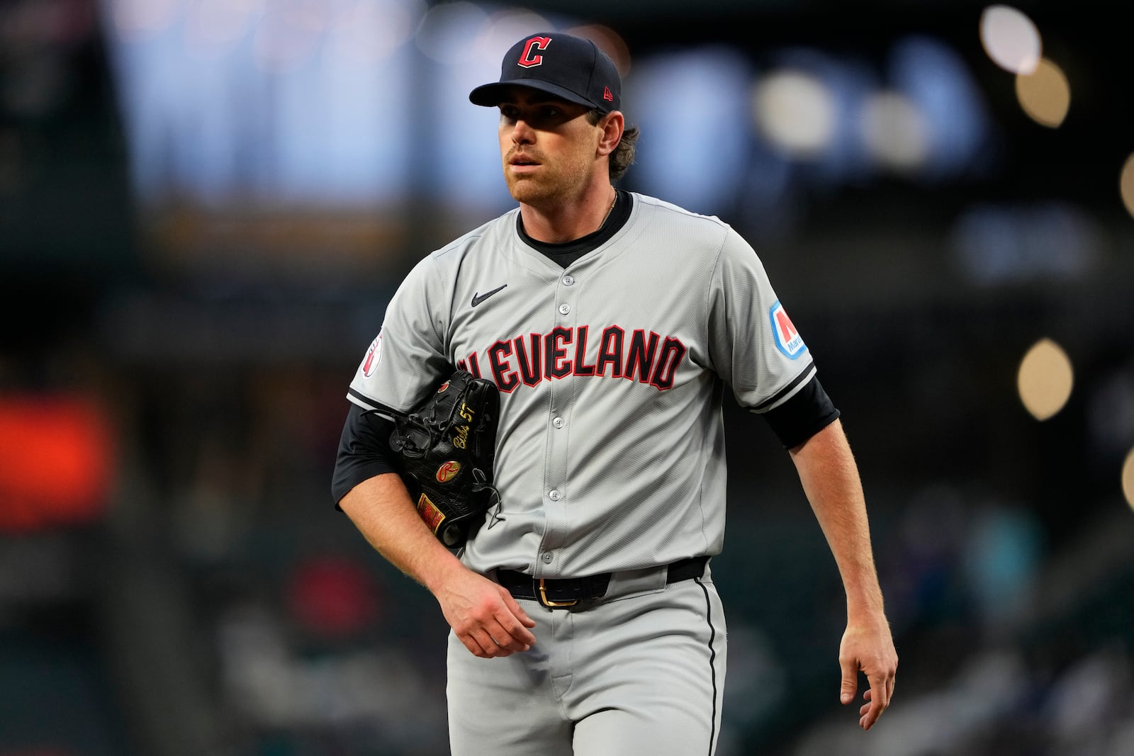 FILE - Cleveland Guardians starting pitcher Shane Bieber walks back to the dugout after throwing against the Seattle Mariners in a baseball game Tuesday, April 2, 2024, in Seattle. (AP Photo/Lindsey Wasson, File)