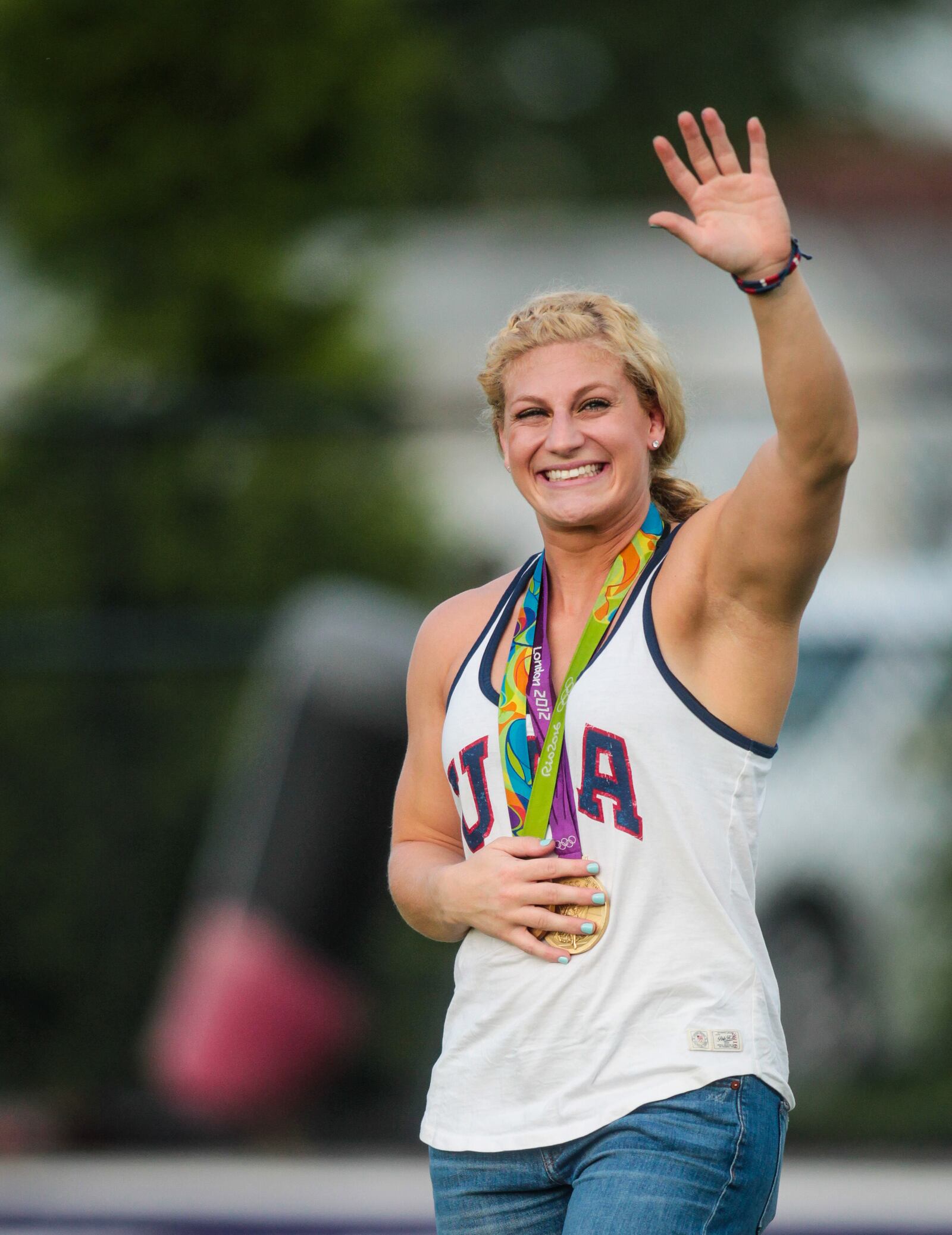 Kayla Harrison, two-time Olympic Gold Medalist in Judo, takes the field with her gold medals before the Middies game Friday, Sept. 9, 2016, at Barnitz Stadium in Middletown. NICK GRAHAM/FILE