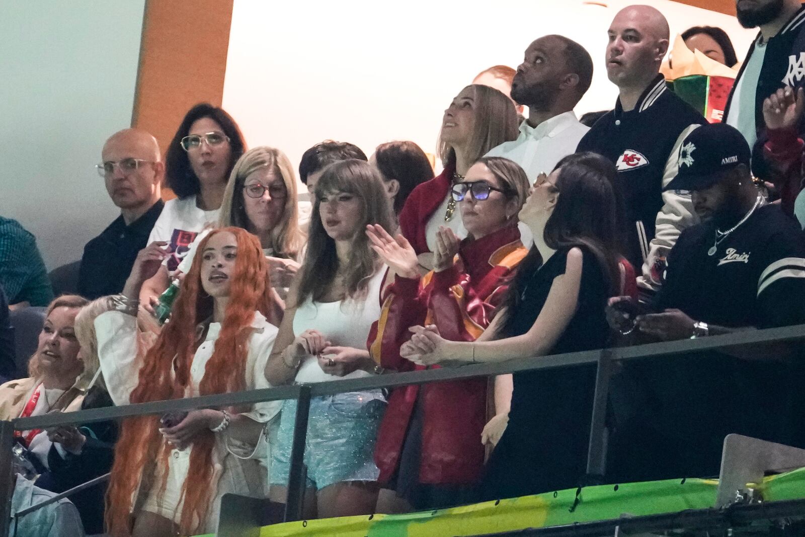 Ice Spice, from left, Taylor Swift, Este Haim, Alana Haim and Ashley Avignone, back center, watch during the first half of the NFL Super Bowl 59 football game between the Kansas City Chiefs and the Philadelphia Eagles, Sunday, Feb. 9, 2025, in New Orleans. (AP Photo/Gerald Herbert)