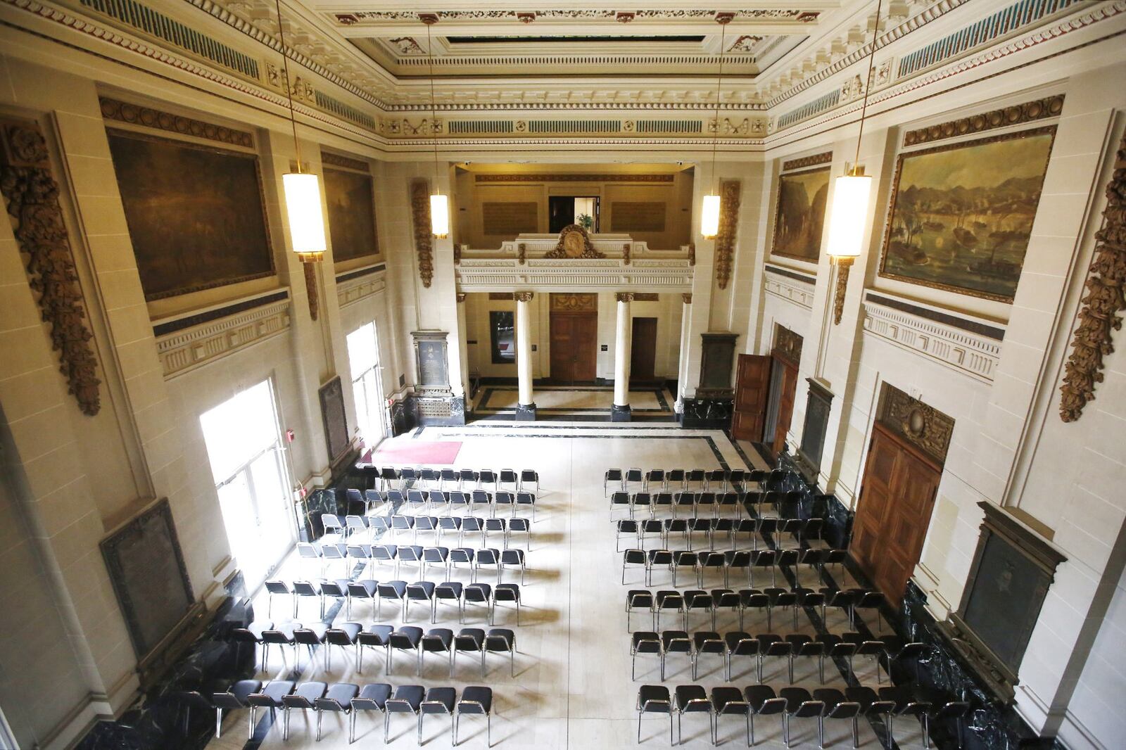 The marbled atrium of Memorial Hall. This prominent - but languishing - historic downtown Dayton building could be better positioned for a comeback after Montgomery County, the owner of Memorial Hall, enters into an agreement Tuesday with a developer. Montgomery County Commissioners are expected to approve a deal with the Dayton-Montgomery County Port Authority and Woodard Development, a partner in the nearby mixed-use Water Street Development that continues to grow with the recent addition of 100 more apartments beyond the outfield walls at Fifth Third Field. Woodard Development seeks the right-of-first refusal to redevelop Memorial Hall at 125 E. First St. The port authority has agreed to accept the transfer of the property from the county so long as a redevelopment plan - which includes historic preservation of the building - is acceptable to all the parties, according to county documents. TY GREENLEES / STAFF