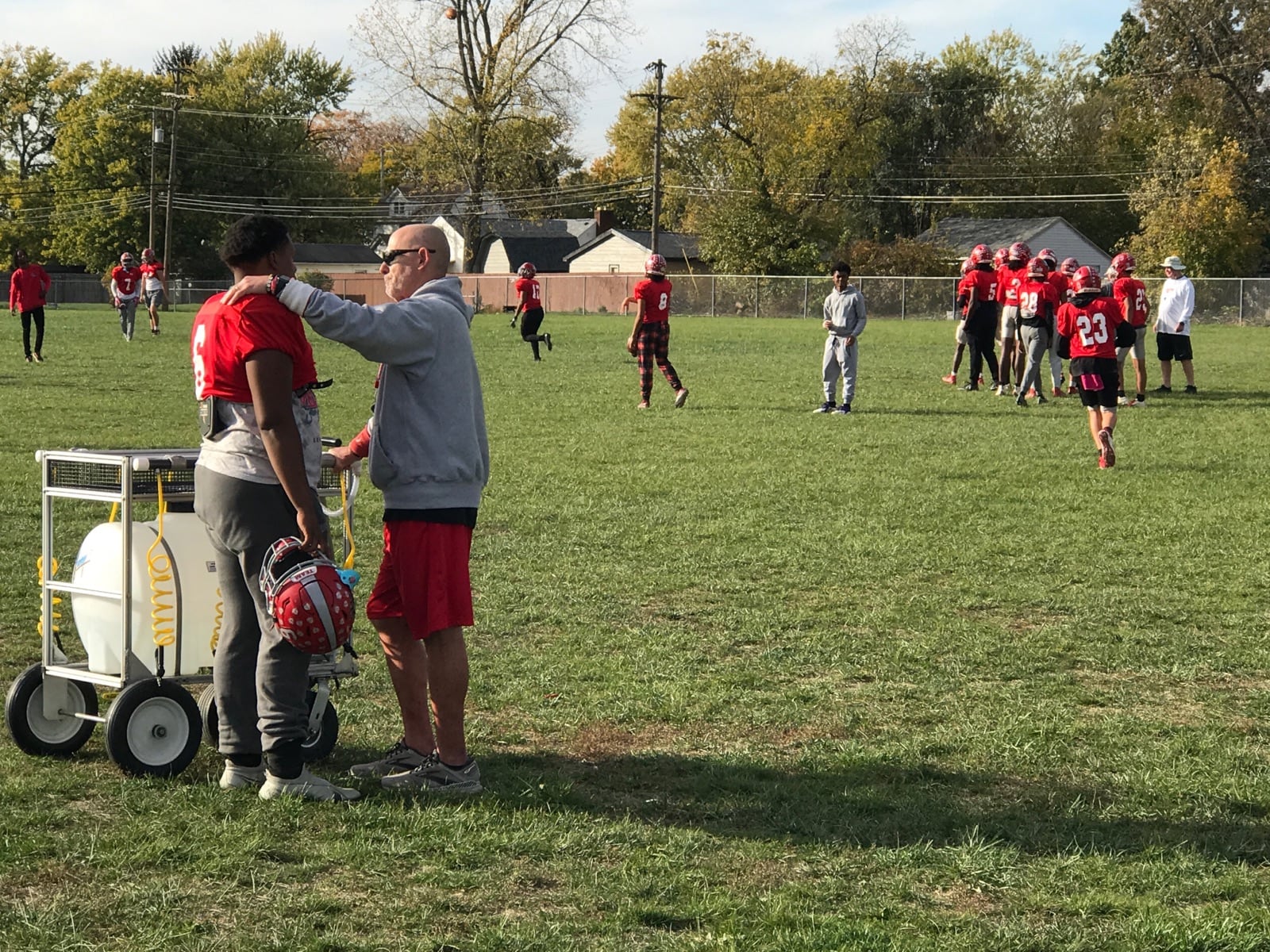 Northridge football coach Bob Smith counseling Eddye Conners at practice earlier this week. Tom Archdeacon/CONTRIBUTED