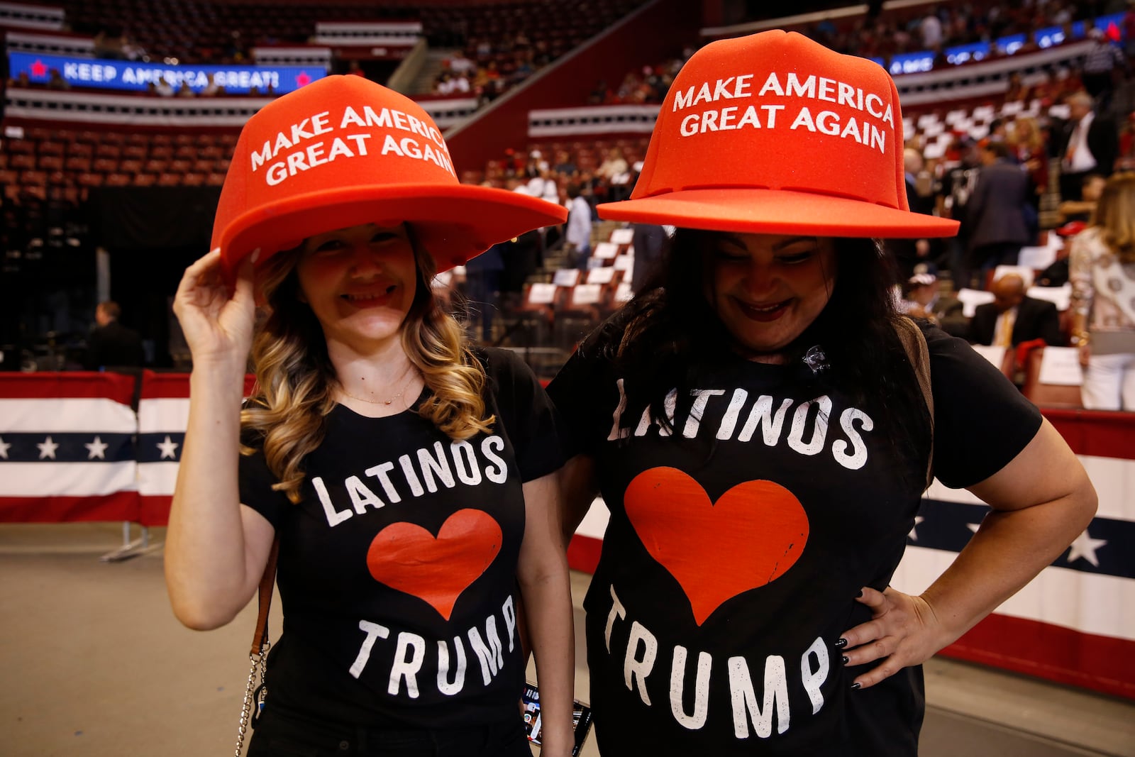 FILE - Supports wear large "Make America Great Again" hats before President Donald Trump's rally on Tuesday, Nov. 26, 2019, in Sunrise, Fla. (AP Photo/Brynn Anderson, File)