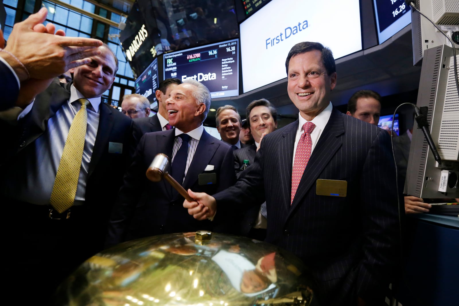 FILE - Frank Bisignano, right, then Chairman and CEO of First Data, smiles after the company's IPO at the New York Stock Exchange, Oct. 15, 2015. (AP Photo/Richard Drew, File)