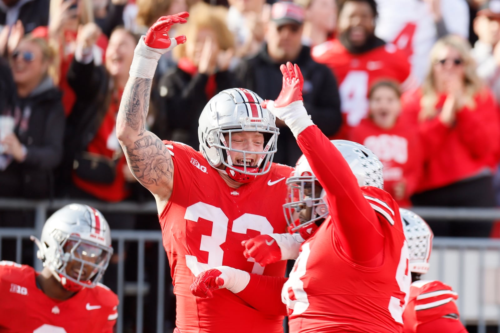 Ohio State defensive lineman Jack Sawyer, left, celebrates his fumble recovery and touchdown against Purdue during the second half of an NCAA college football game Saturday, Nov. 9, 2024, in Columbus, Ohio. (AP Photo/Jay LaPrete)